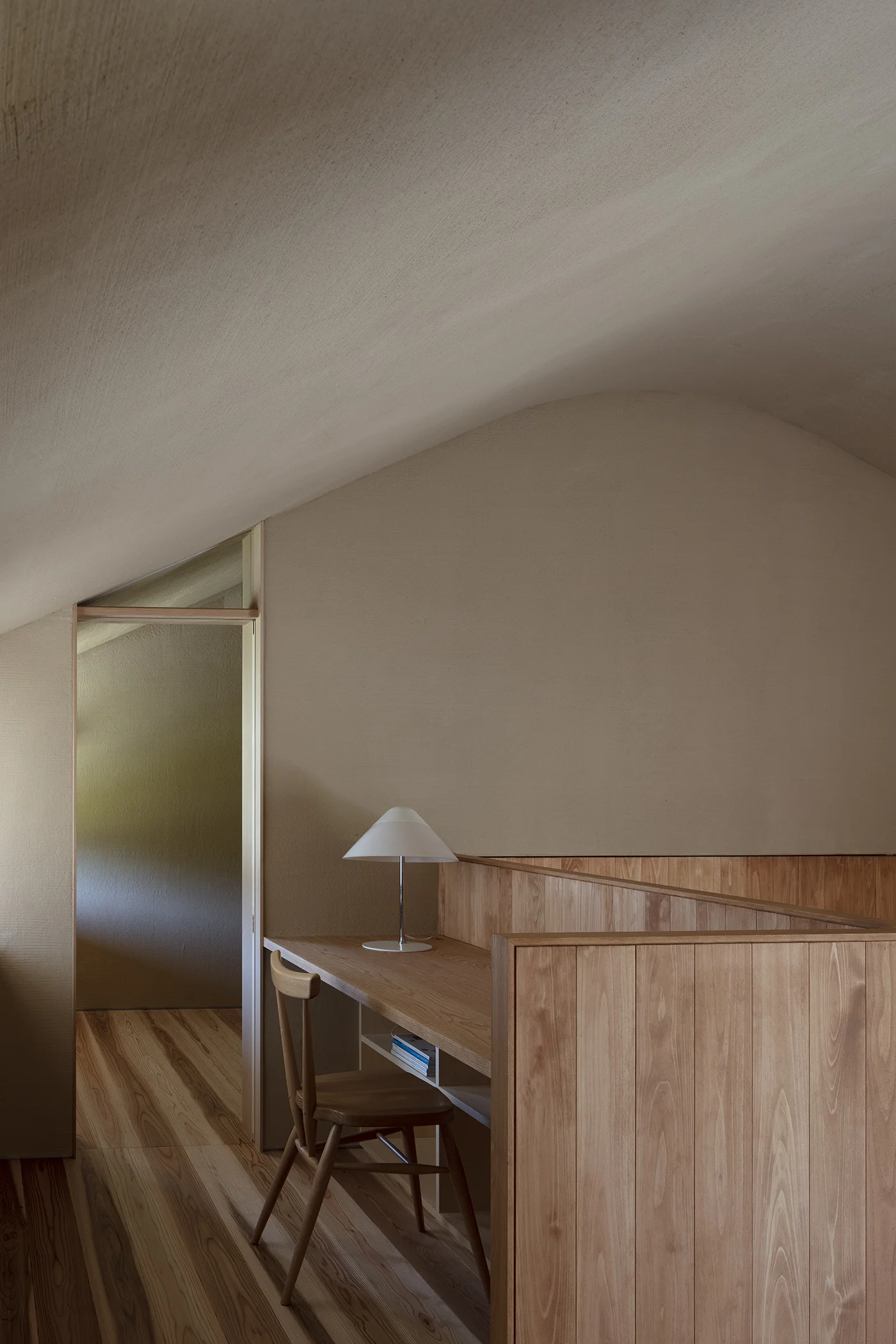 House in Seichodai by Mononoma, photographed by Norihito Yamauchi — Interior view of a bathing space framed by expansive glazing.