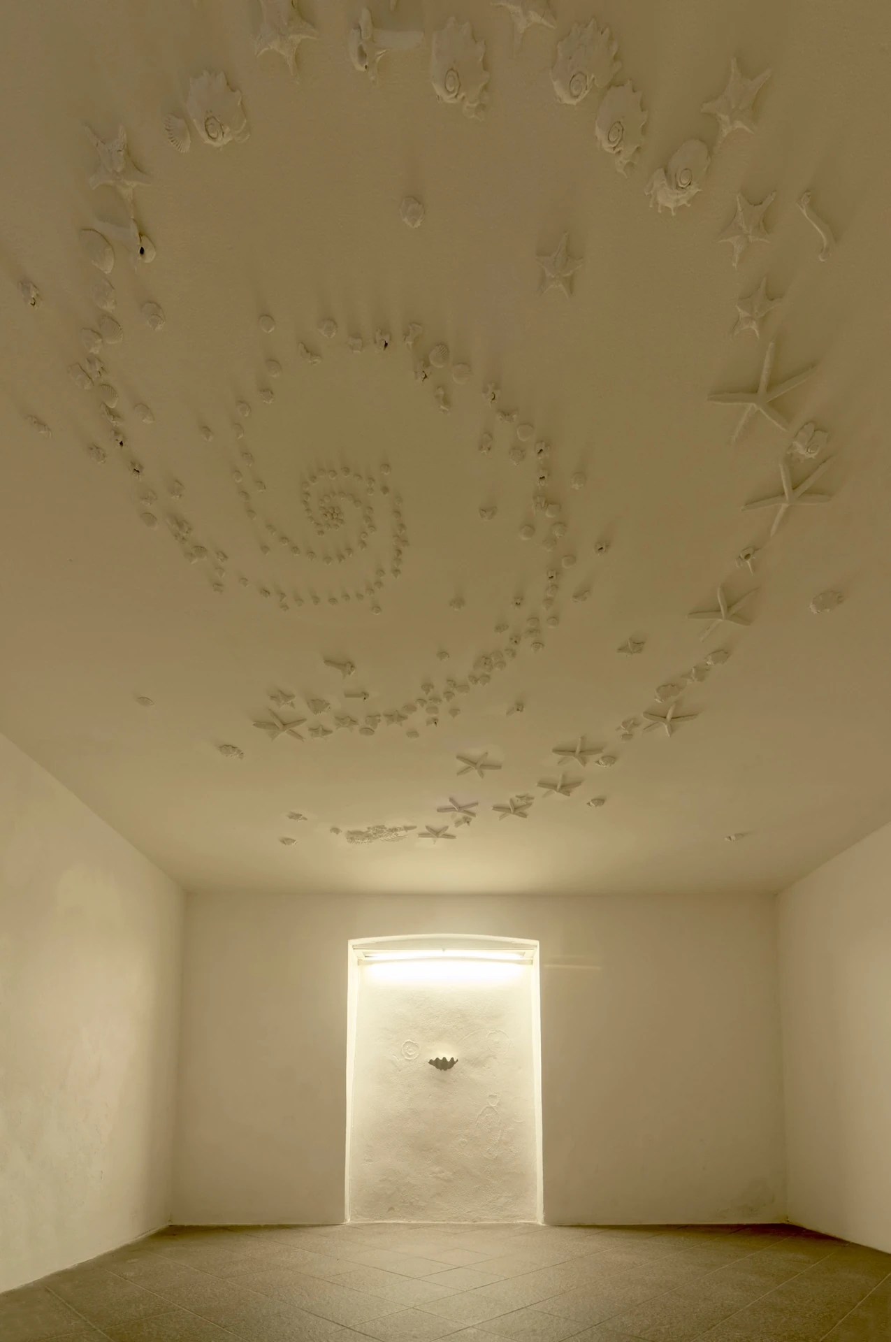 The Fire and its Ghosts by Andrea Luzi + Nicola Ghirardelli, photographed by Oscar Giacomini — Detail of Barrueco's irregular pearl, cast in plaster and frame with bone and shell motifs.