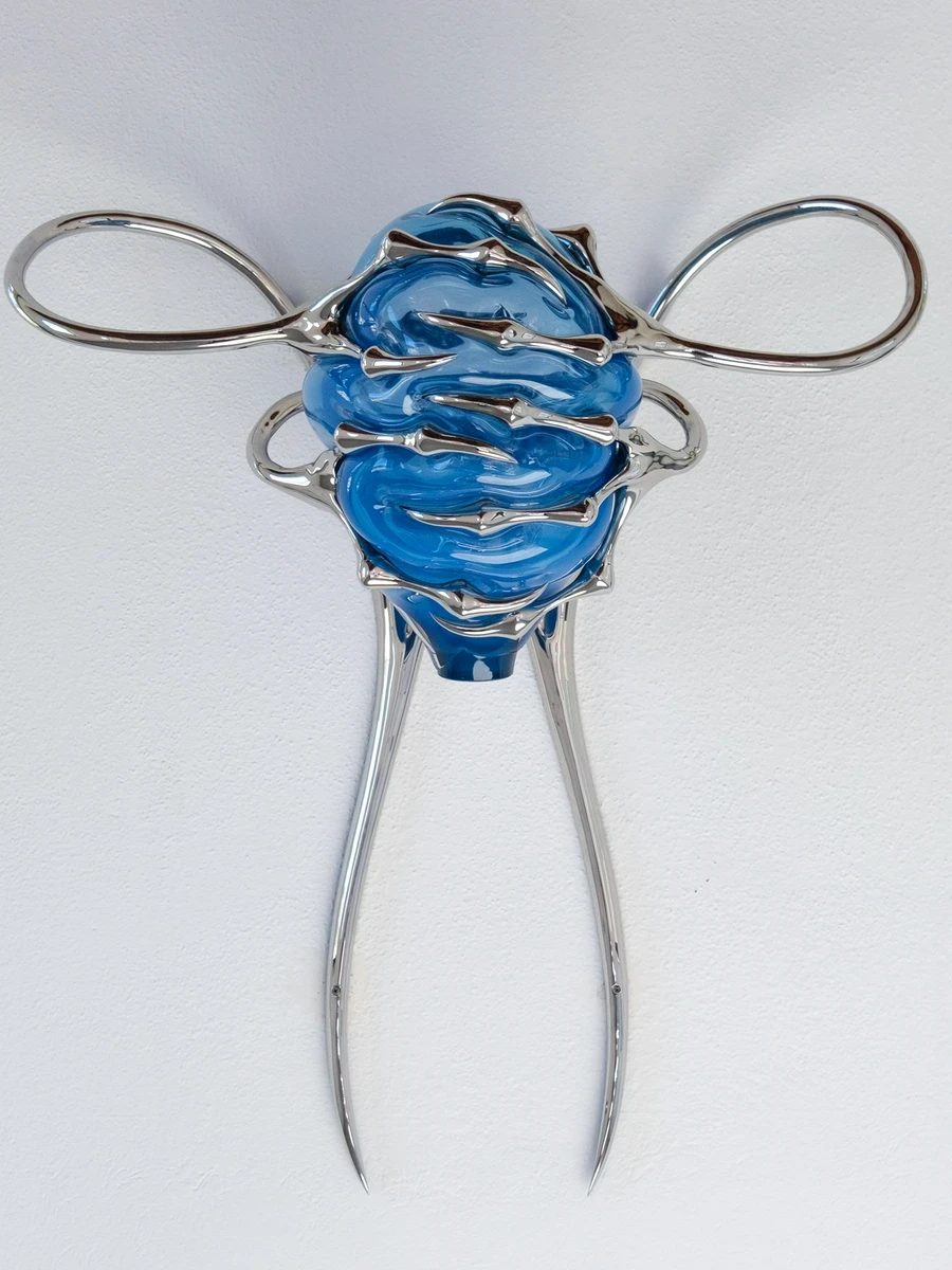 Blue Blooded — Sangue blu by Hannah Levy at Museo Nivola, Orani — a polished-steel and silicone canopy hangs in the arched-window nave of the former communal washhouse.