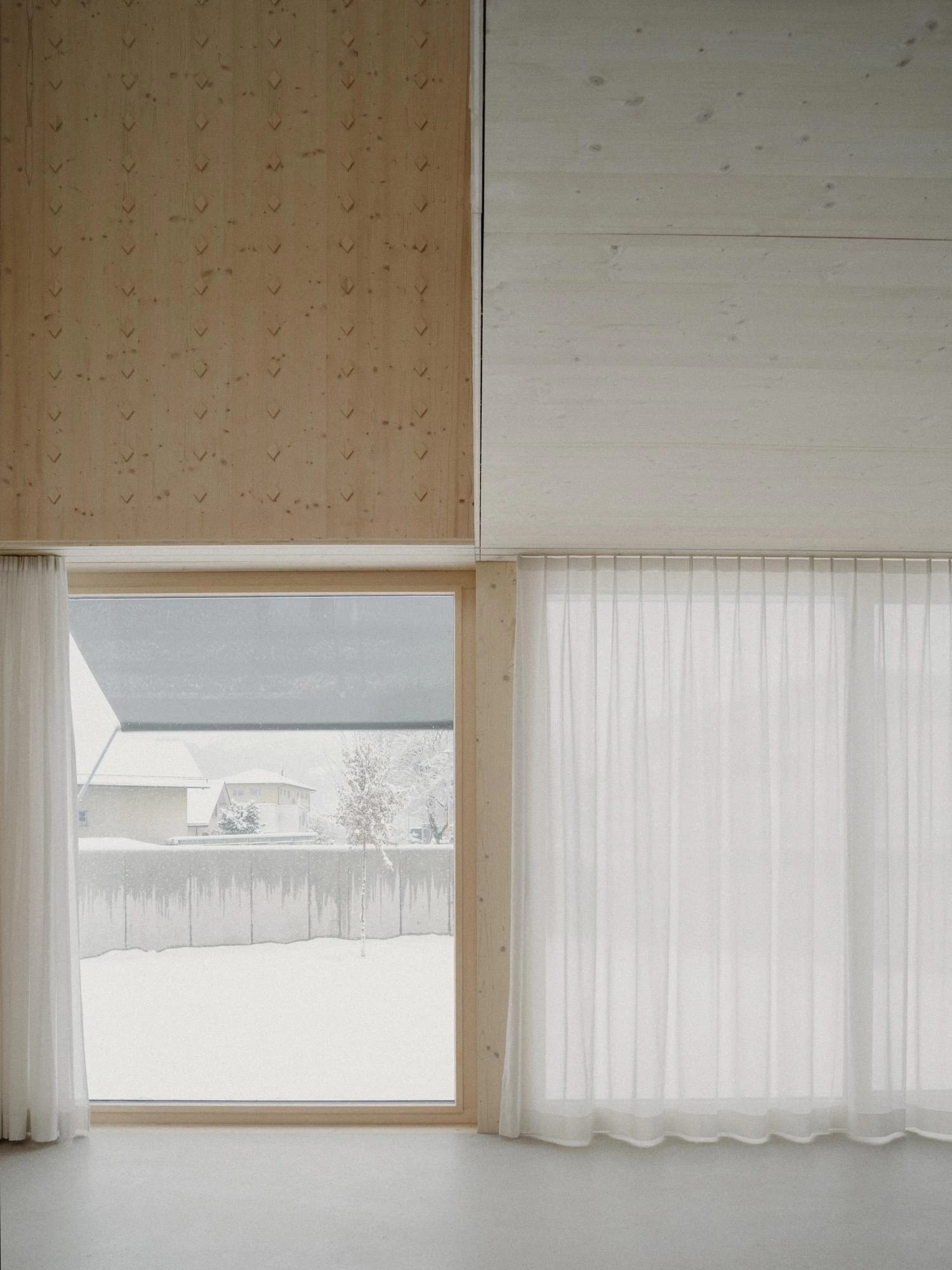 Tower House by kit, photographed by Till Forrer — Interior detail of the galvanised steel balustrade at the stair; flattened bar uprights at regular spacing against the spruce stair side.