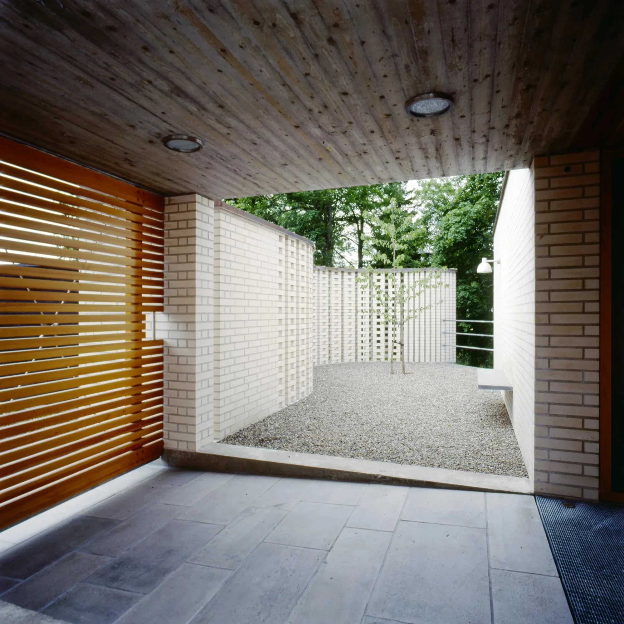 Mortuary at Asker Crematorium by Carl-Viggo Hølmebakk AS, photographed by Carl-Viggo Hølmebakk, Per Berntsen, Nils Petter Dale, Jiri Havran — Interior of the ceremony room: ground concrete floor meets the base of the brick vault, the marble inset flush...