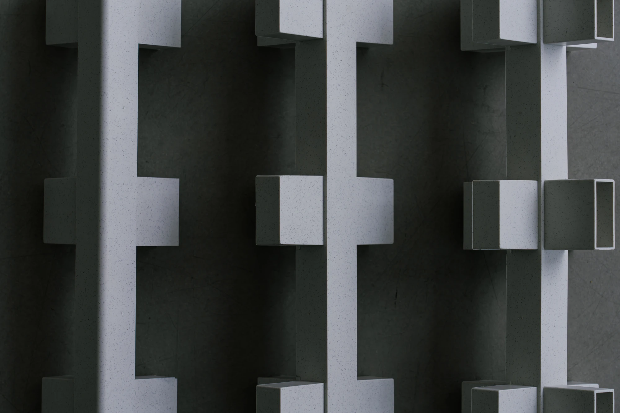 reol: Modular Narratives in Recycled Plastic by reol — Side view of two stacked box units: the joint between them showing the bracket system, the open faces aligned, the whole reading as a small shelf volume.