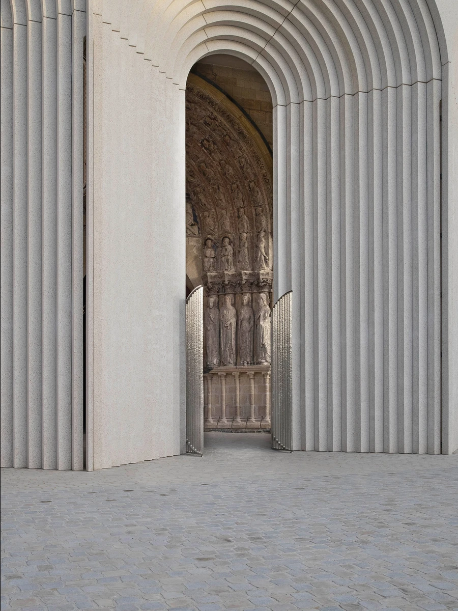 Angers Cathedral Entrance by Kengo Kuma and Associates — Angers, France: Loire-cast concrete arches shelter a 17th-century tympanum