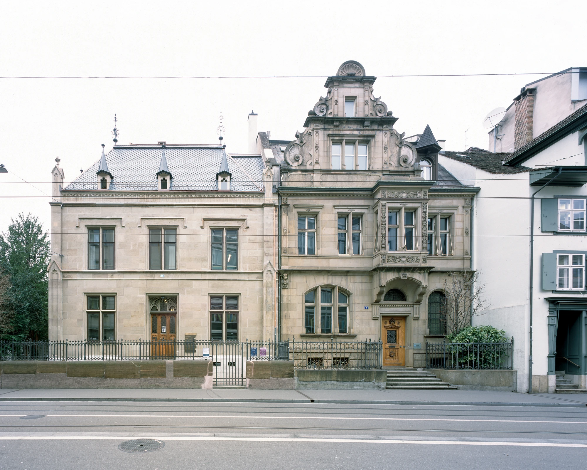 Ehemaliges Pfarrhaus Elisabethenstrasse by Vecsey Schmidt Architekten, photographed by Barbara Buhler — Ornate 1867 Neo-Renaissance sandstone facade with mansard roof and baroque gable on Elisabethenstrasse, Basel.