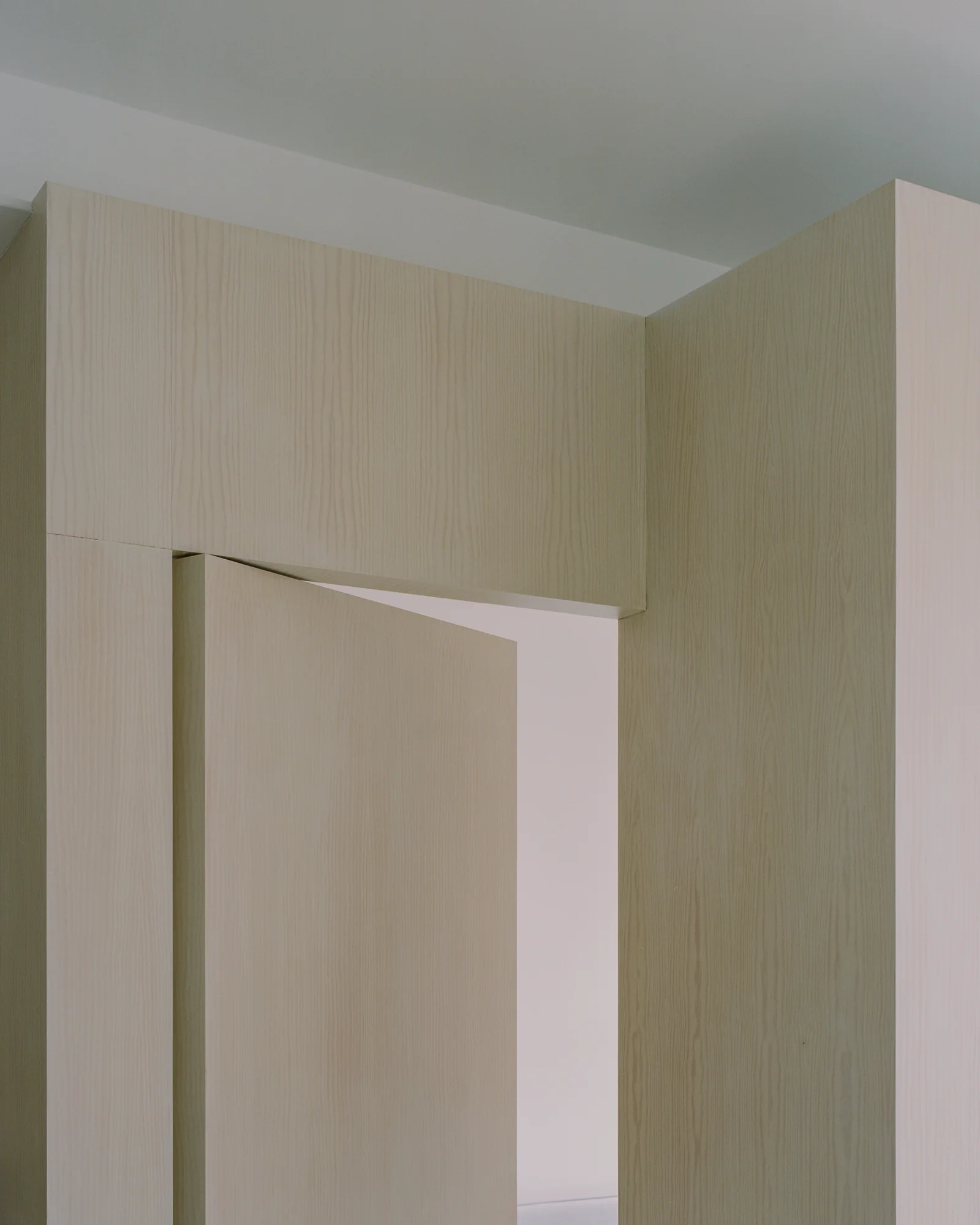 Studio Four by Paraforma — London, United Kingdom: a timber wall system that makes thresholds do the work rooms used to do.