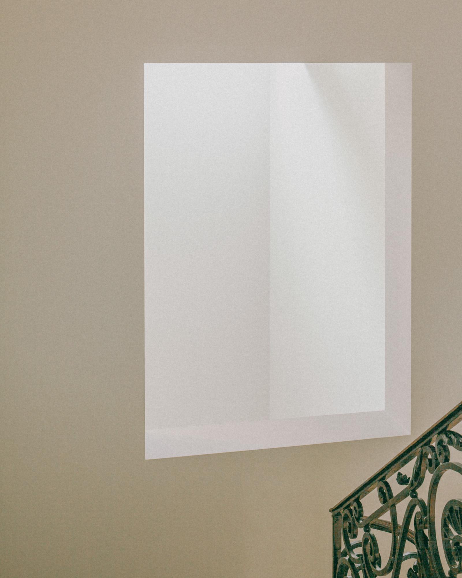 Xavier Hufkens Gallery by Robbrecht en Daem Architecten, photographed by Jeremy Piret — Mansion stairwell with taupe wall bearing white monochrome painting, ornate green wrought iron balustrade, diagonal light across wall.
