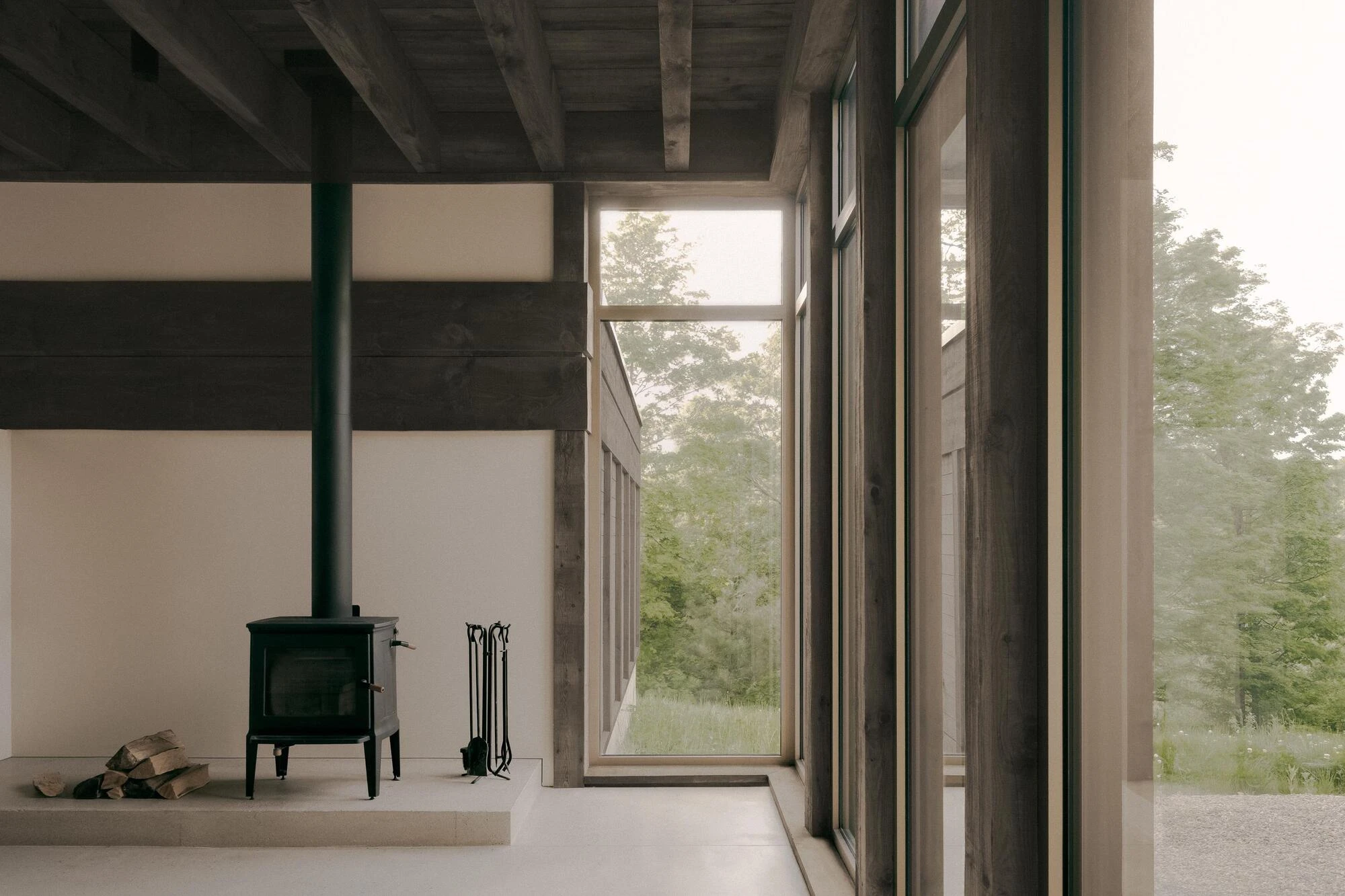 SONO Residence by Atelier Carle, Wentworth-North Quebec Canada, mountain second home, board-formed concrete, hemlock structure, forest view, photographed by Félix Michaud