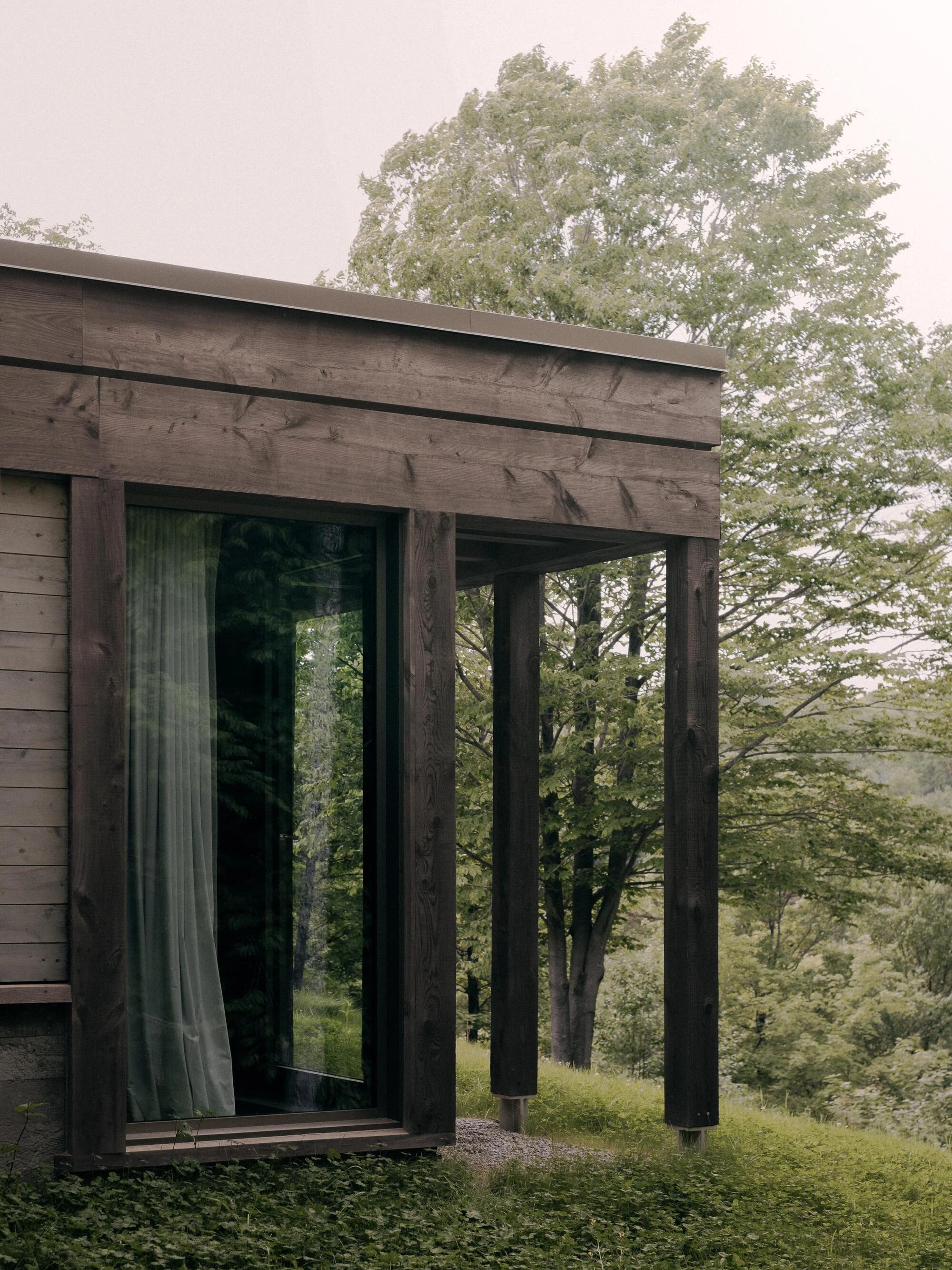 SONO Residence by Atelier Carle, Wentworth-North Quebec Canada, mountain second home, board-formed concrete, hemlock structure, forest view, photographed by Félix Michaud