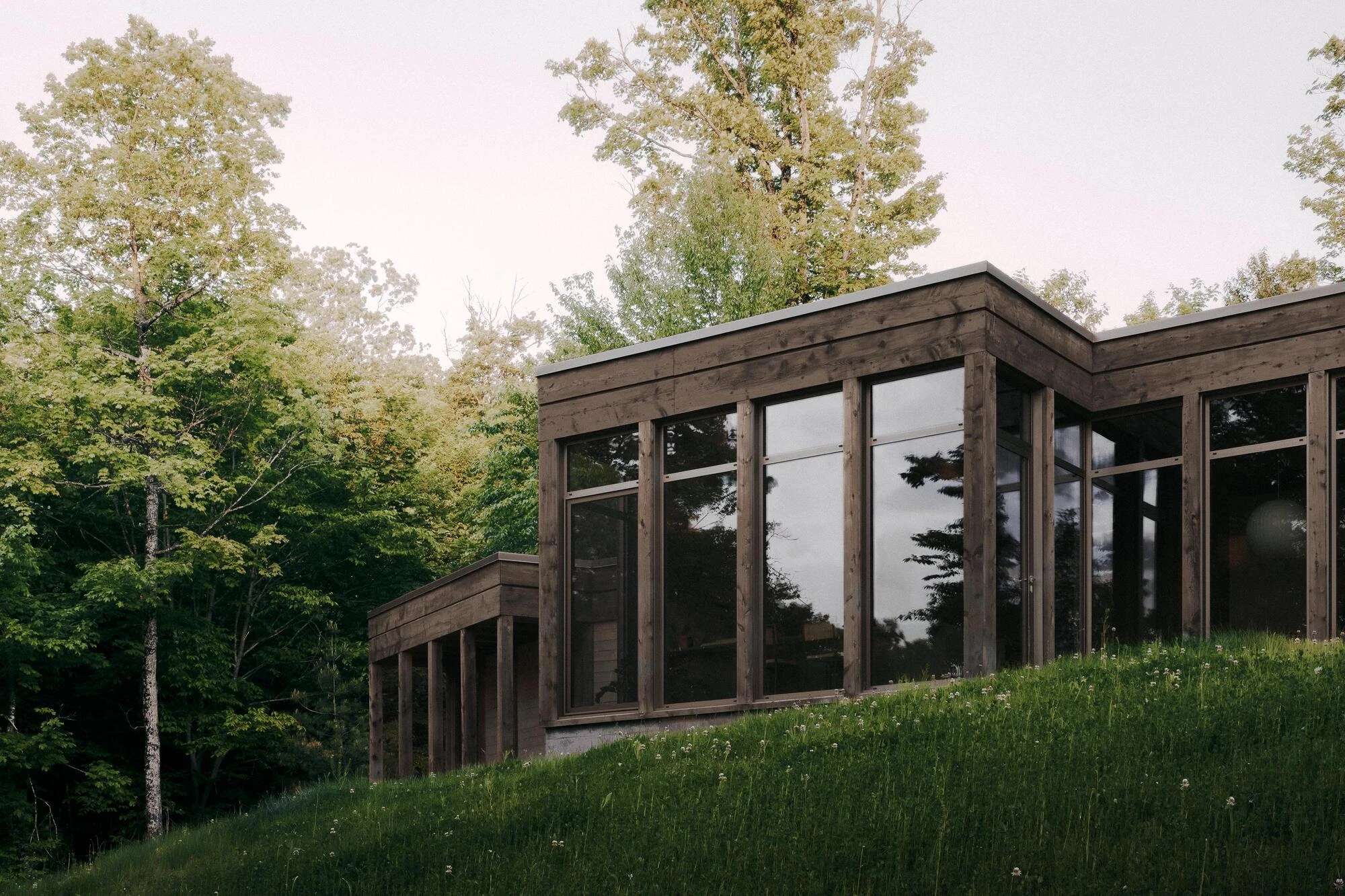 SONO Residence by Atelier Carle, Wentworth-North Quebec Canada, mountain second home, board-formed concrete, hemlock structure, forest view, photographed by Félix Michaud