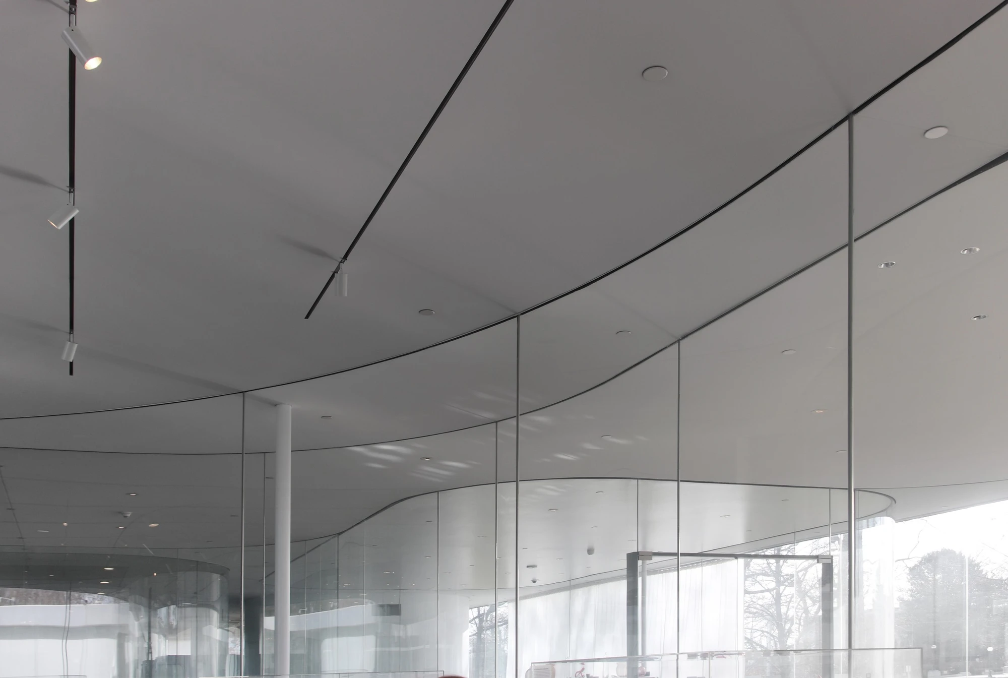 Toledo Museum Glass Pavilion by SANAA, Toledo Ohio USA, curved low-iron laminated glass, double-skin envelope, hot shop gallery adjacency, photographed by Trevor Patt