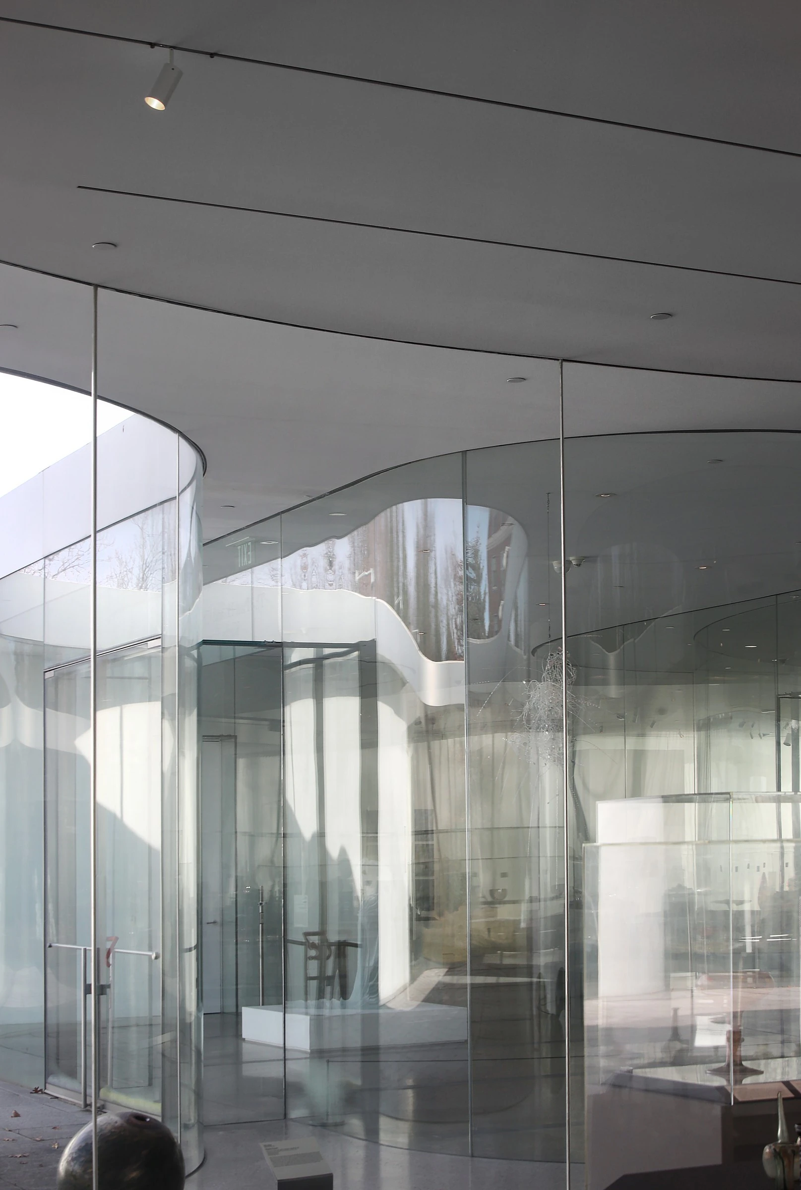 Toledo Museum Glass Pavilion by SANAA, Toledo Ohio USA, curved low-iron laminated glass, double-skin envelope, hot shop gallery adjacency, photographed by Trevor Patt