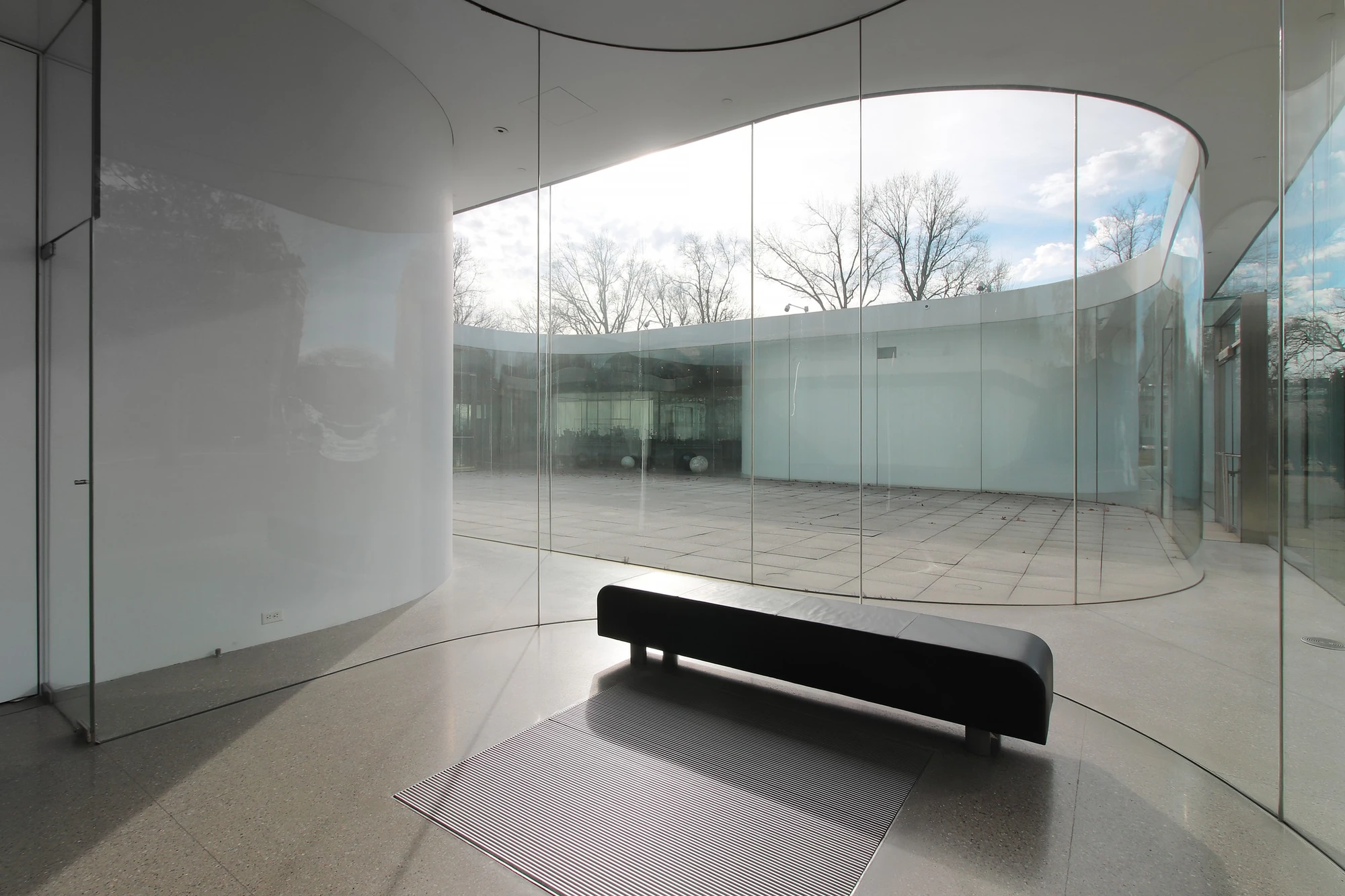 Toledo Museum Glass Pavilion by SANAA, Toledo Ohio USA, curved low-iron laminated glass, double-skin envelope, hot shop gallery adjacency, photographed by Trevor Patt