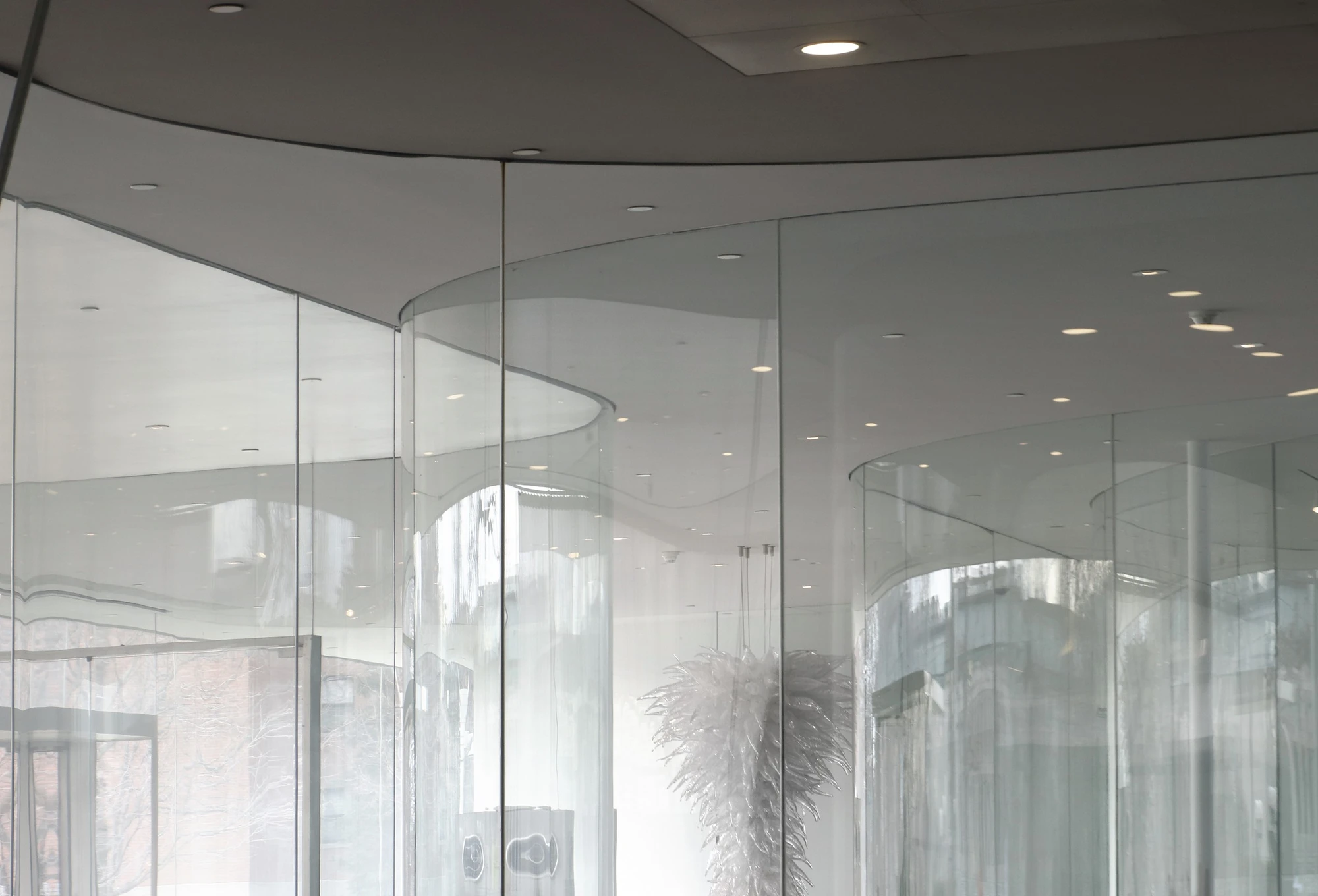 Toledo Museum Glass Pavilion by SANAA, Toledo Ohio USA, curved low-iron laminated glass, double-skin envelope, hot shop gallery adjacency, photographed by Trevor Patt