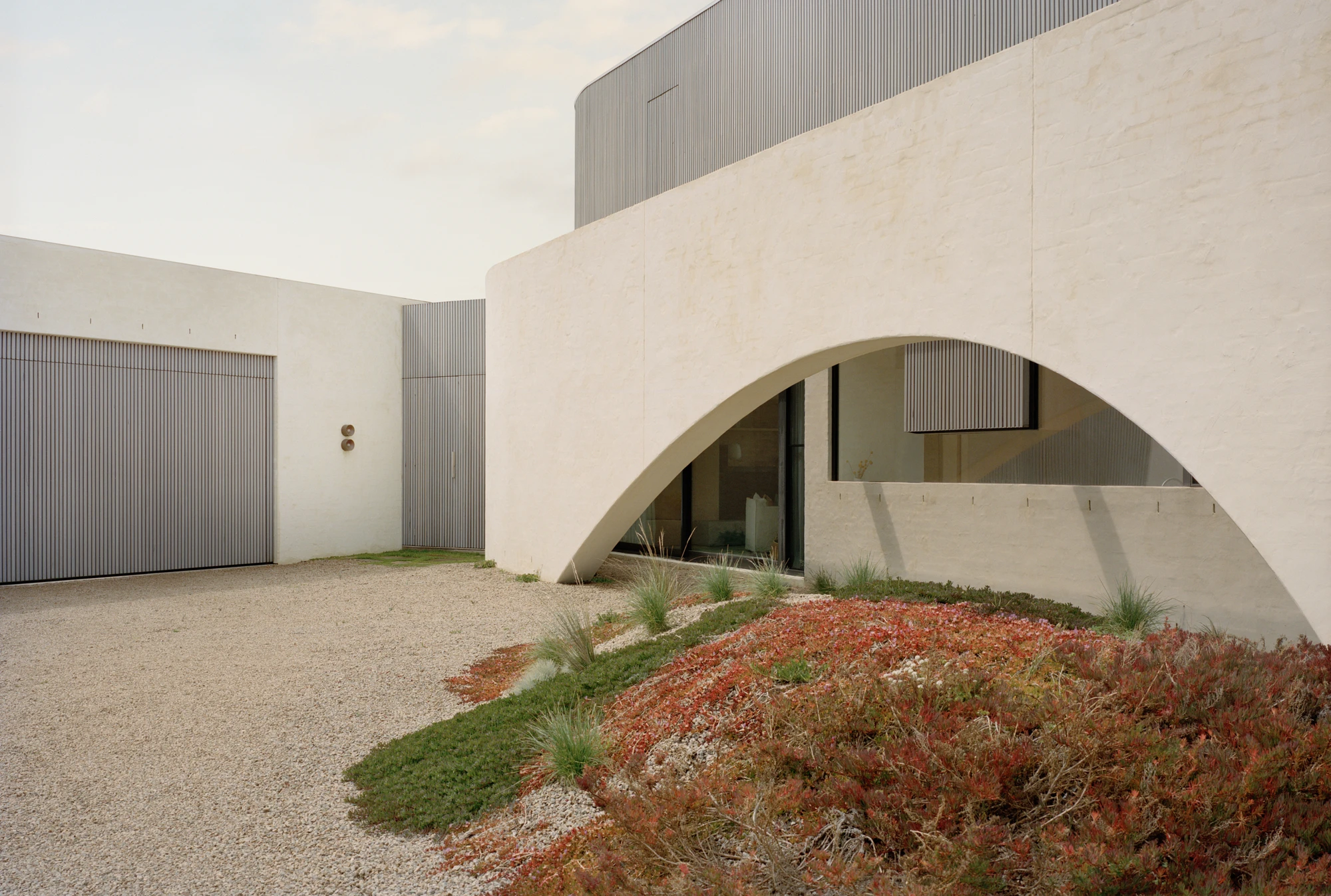 Wildcoast House by Pandolfini Architects, Mornington Peninsula Victoria Australia, three blade walls, recycled D-grade brick, Moonah timber, coastal landscape, photographed by Tasha Tylee