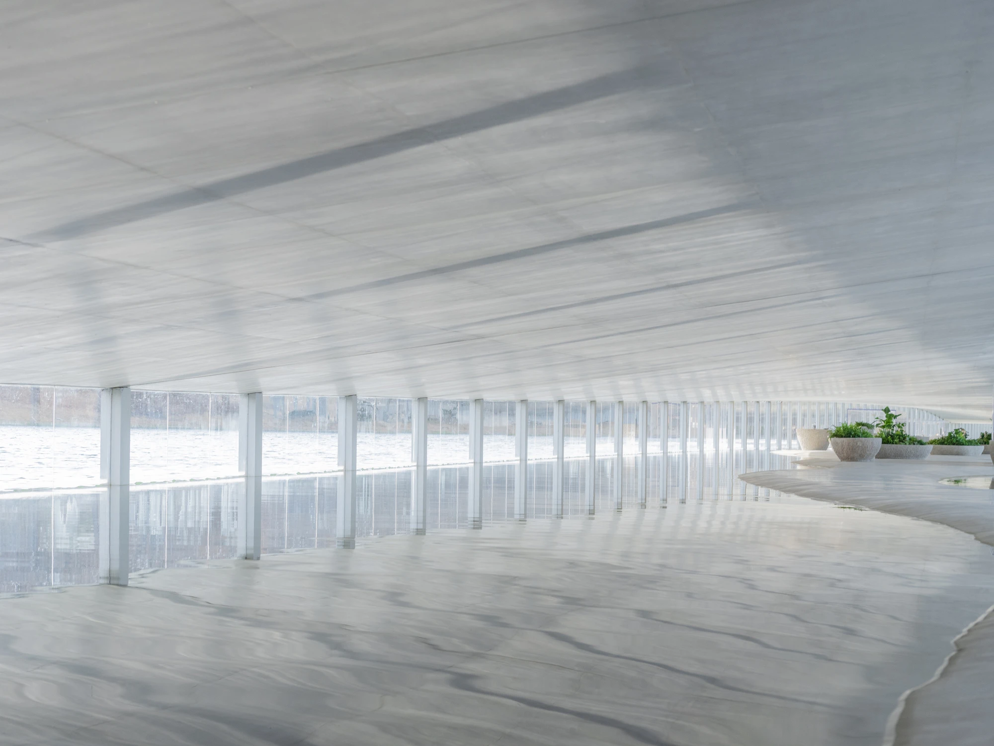 Zaishui Art Museum by junya ishigami + associates, Rizhao Shandong China, one kilometre long, lake, slender columns in water, sash roof, photographed by arch-exist