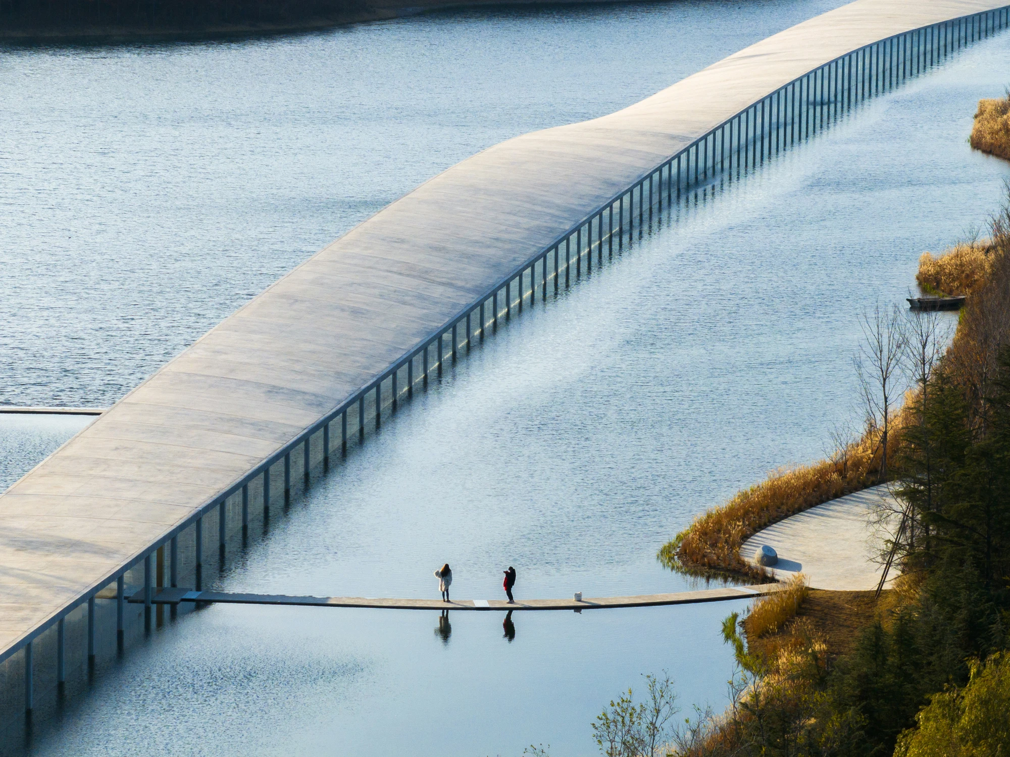 Zaishui Art Museum by junya ishigami + associates, Rizhao Shandong China, one kilometre long, lake, slender columns in water, sash roof, photographed by arch-exist
