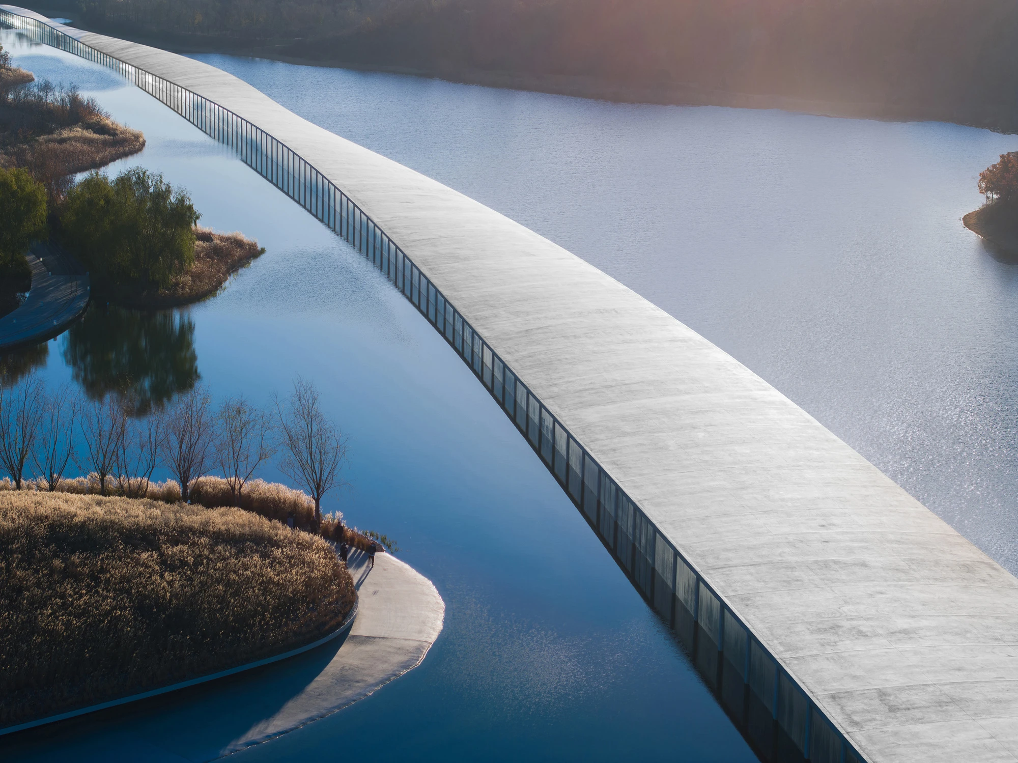 Zaishui Art Museum by junya ishigami + associates, Rizhao Shandong China, one kilometre long, lake, slender columns in water, sash roof, photographed by arch-exist