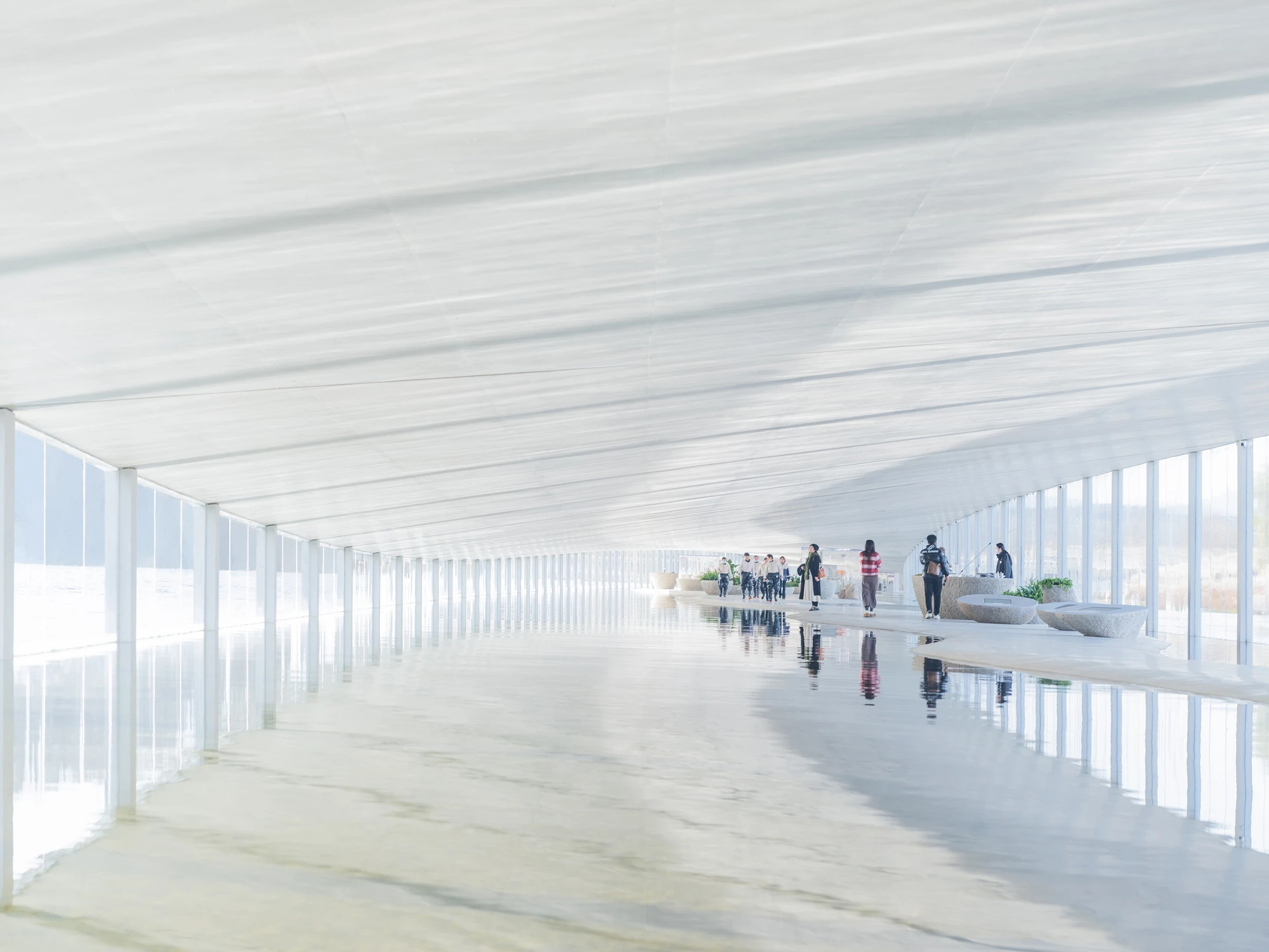 Zaishui Art Museum by junya ishigami + associates, Rizhao Shandong China, one kilometre long, lake, slender columns in water, sash roof, photographed by arch-exist