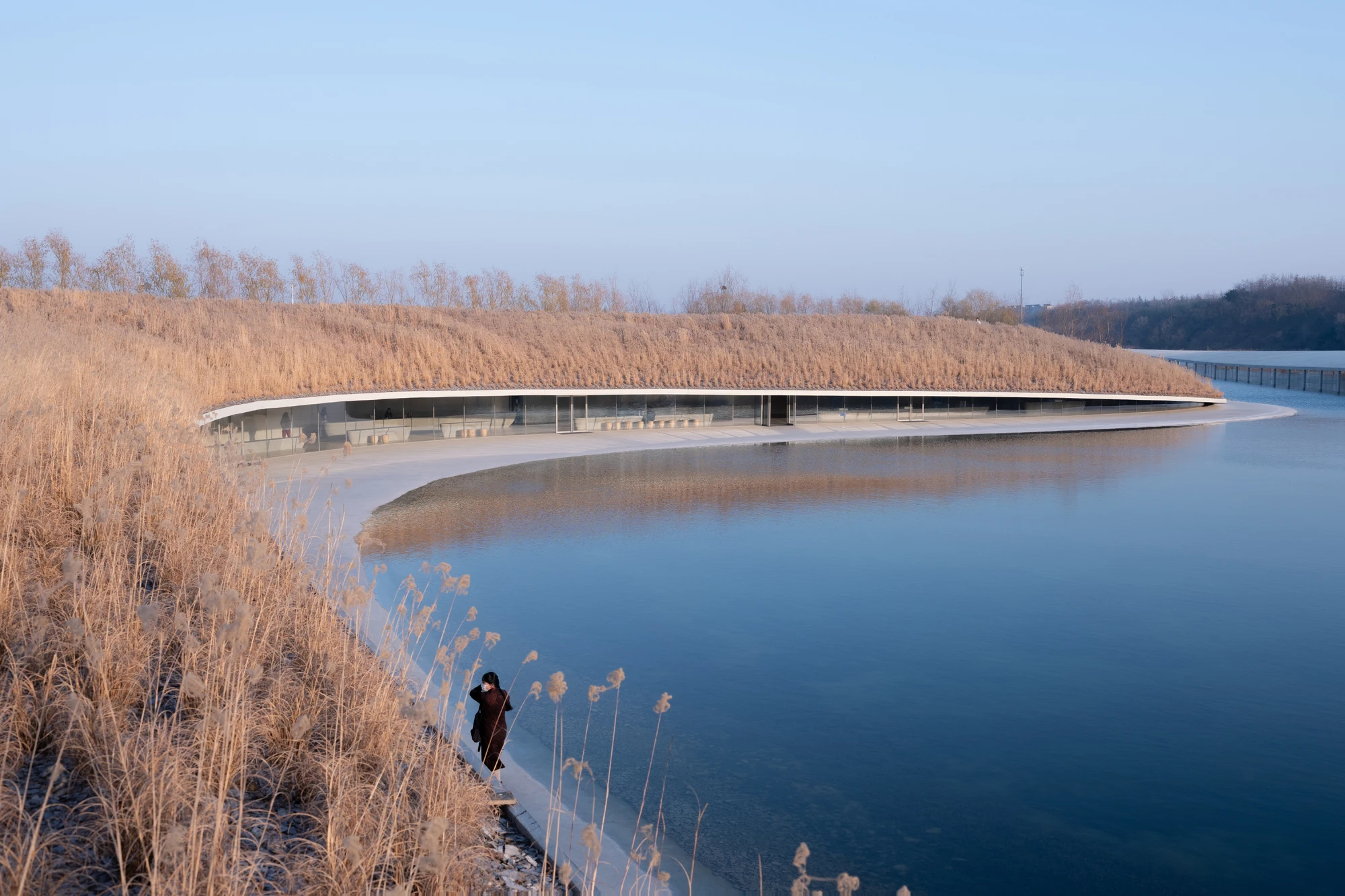 Zaishui Art Museum by junya ishigami + associates, Rizhao Shandong China, one kilometre long, lake, slender columns in water, sash roof, photographed by arch-exist