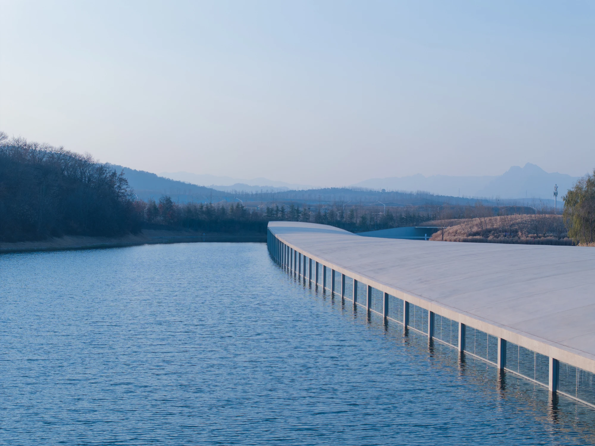 Zaishui Art Museum by junya ishigami + associates, Rizhao Shandong China, one kilometre long, lake, slender columns in water, sash roof, photographed by arch-exist