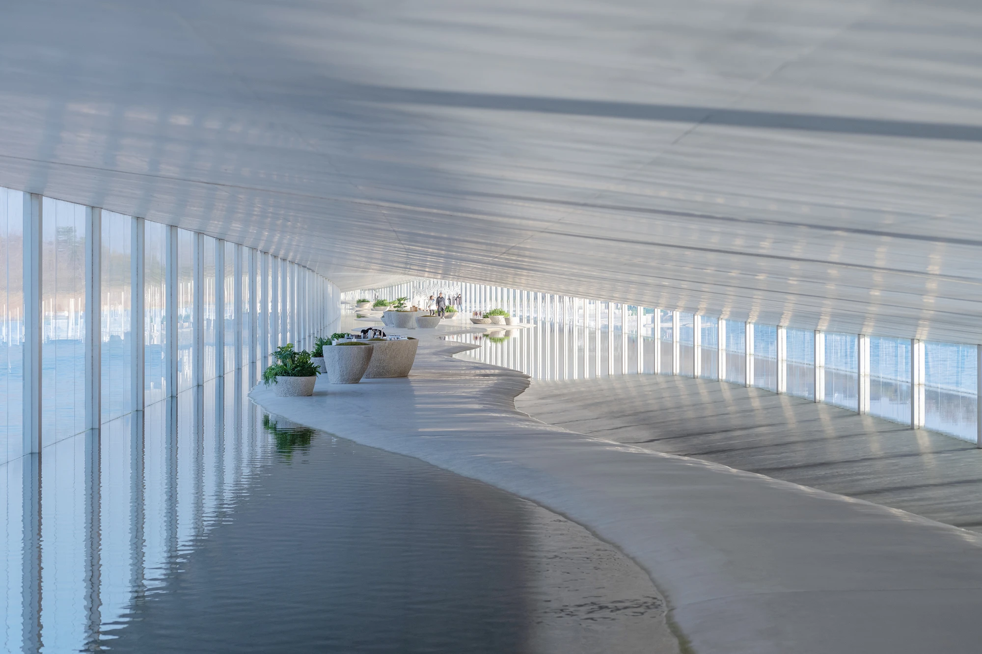 Zaishui Art Museum by junya ishigami + associates, Rizhao Shandong China, one kilometre long, lake, slender columns in water, sash roof, photographed by arch-exist