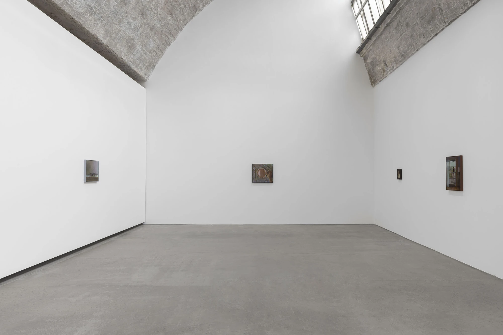 Life on Mars by Cheng Yuzheng, photographed at Reflexion Gallery — three small paintings hung sparsely beneath a brick-vaulted concrete ceiling.