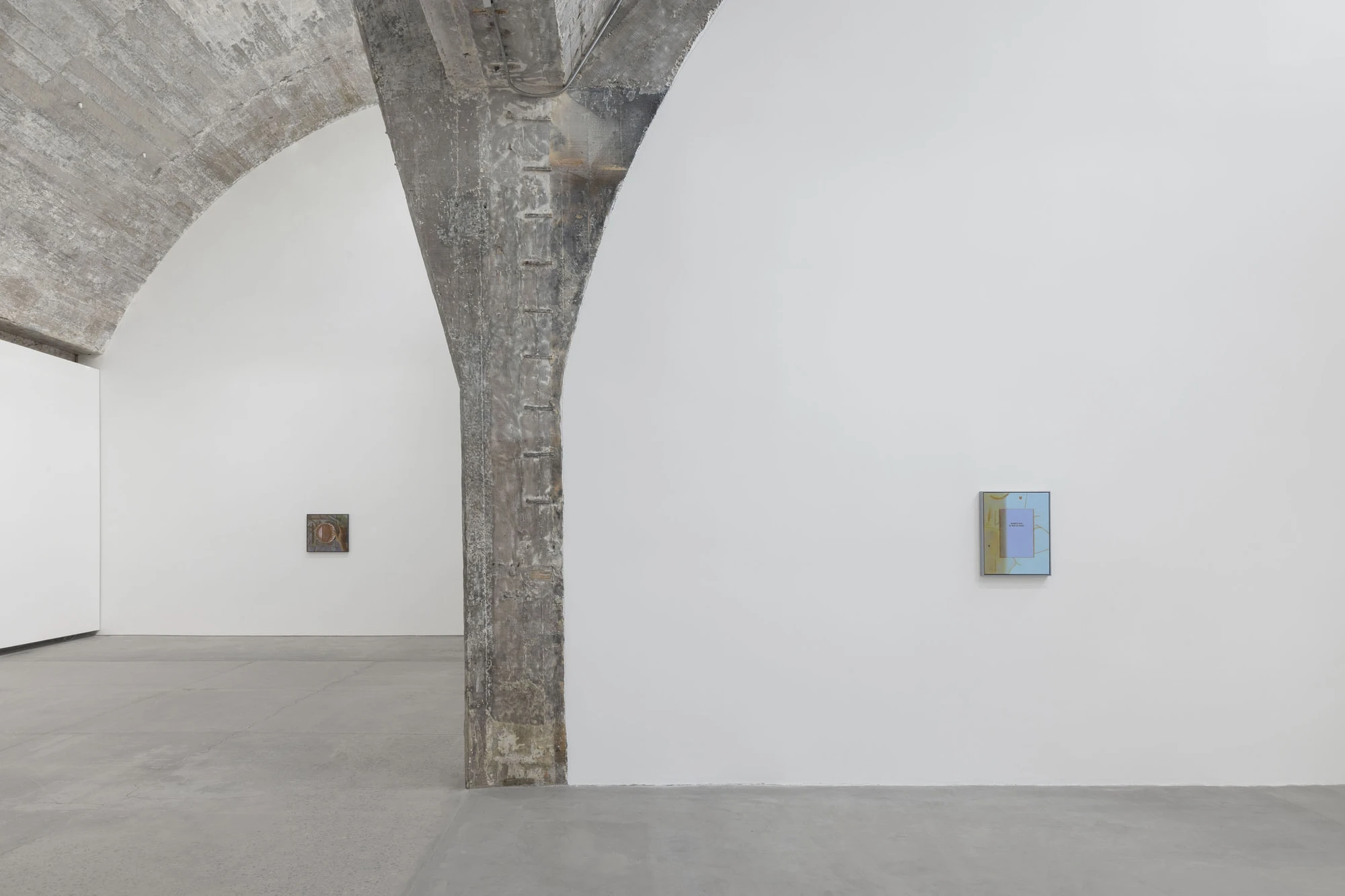 Life on Mars by Cheng Yuzheng, photographed at Reflexion Gallery — a concrete pier divides two paintings, one earthen, one pale blue.