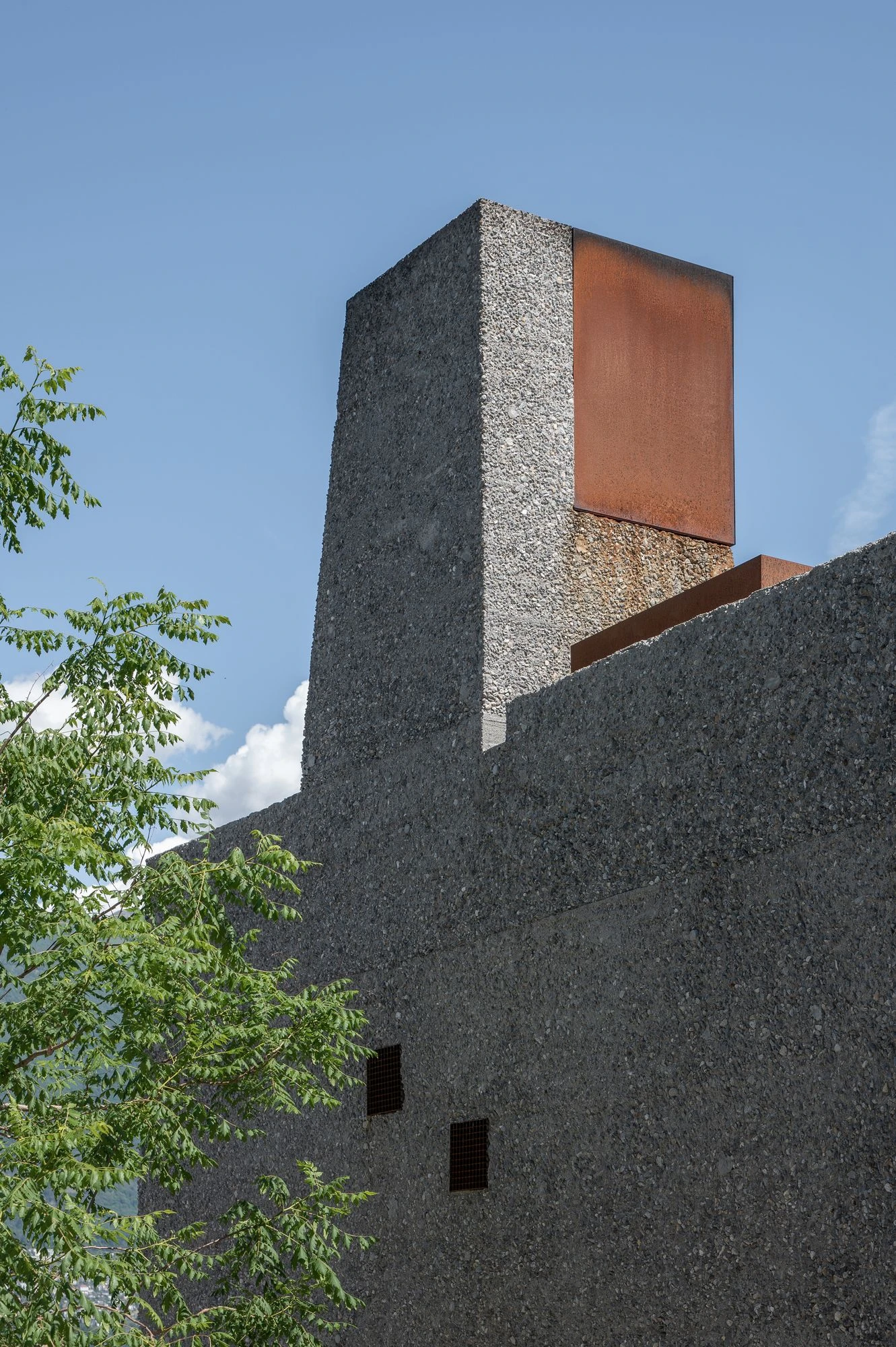 New House in San Nazzaro by Wespi de Meuron Romeo, photographed by Giacomo Albo — the closed street facade with its steel entrance gate set into the wall.