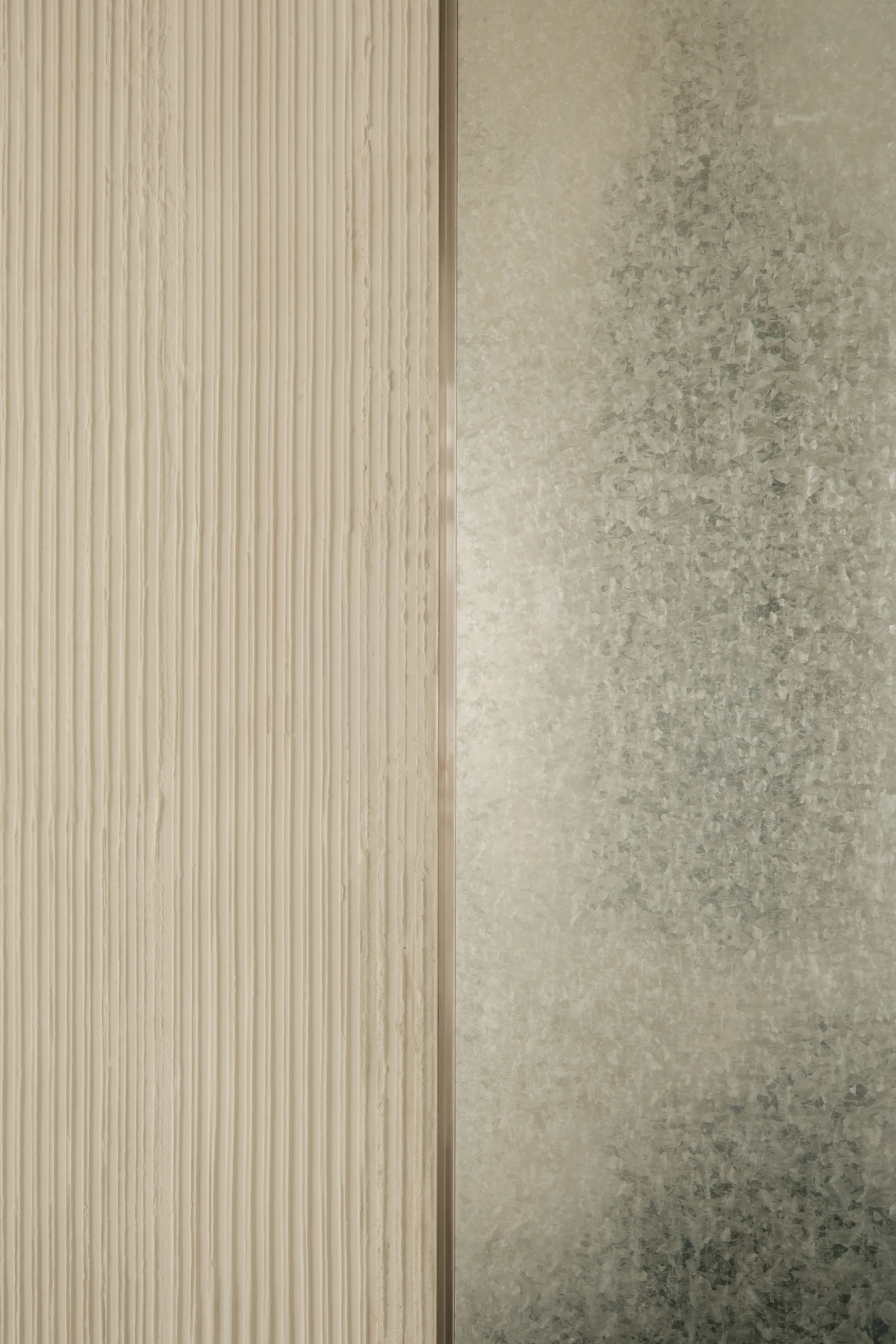 OUNASS STAGE by VAUST, photographed by Nicolas Quiniou — close-up of two adjoining cladding panels: ribbed pale board on the left meeting mottled zinc-spangle galvanized steel on the right.