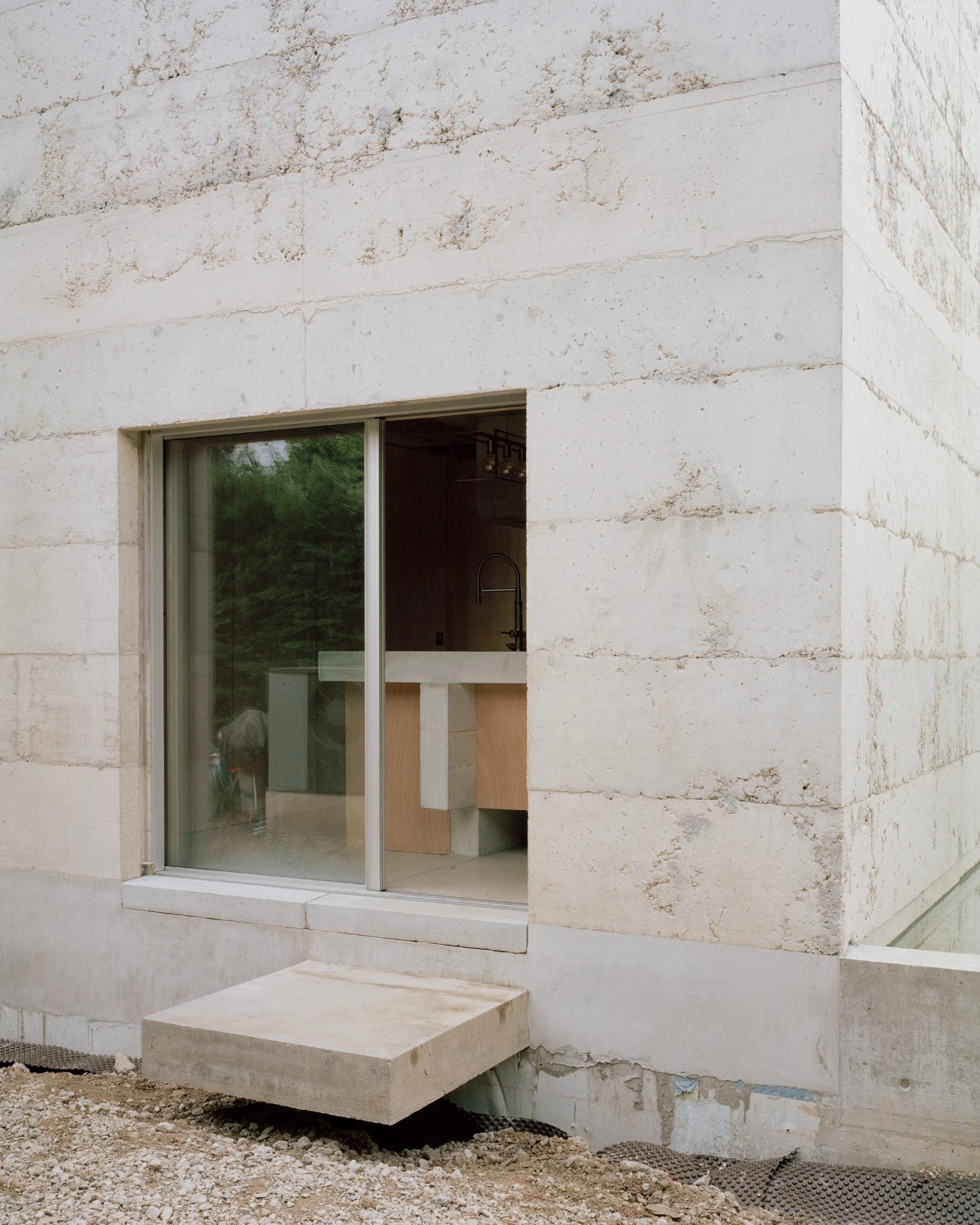 Villa M by Leopold Banchini Architects, Geneva Switzerland, board-formed concrete villa, reflecting water basin, Lake Geneva, Rory Gardiner