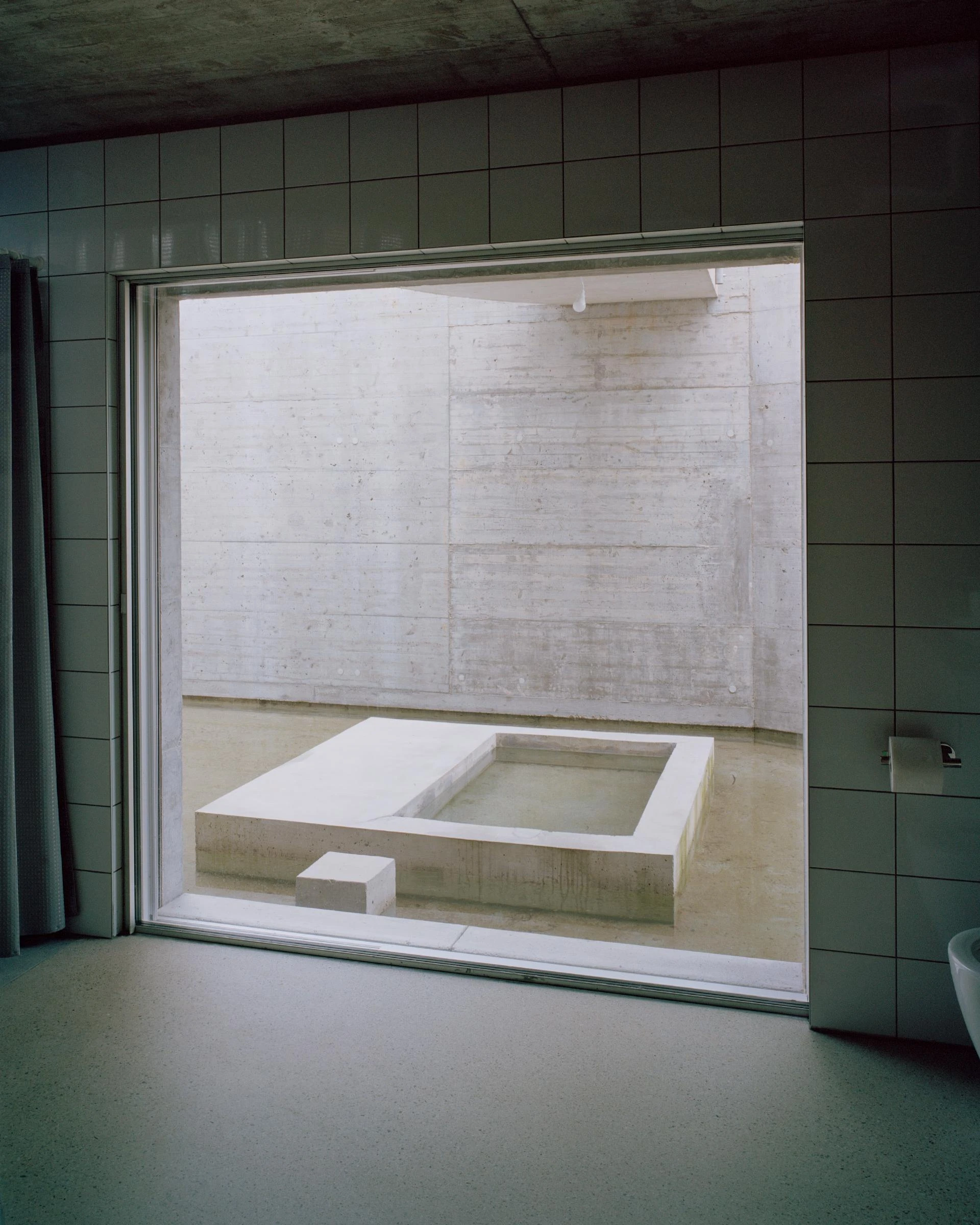 Villa M by Leopold Banchini Architects, Geneva Switzerland, board-formed concrete villa, reflecting water basin, Lake Geneva, Rory Gardiner