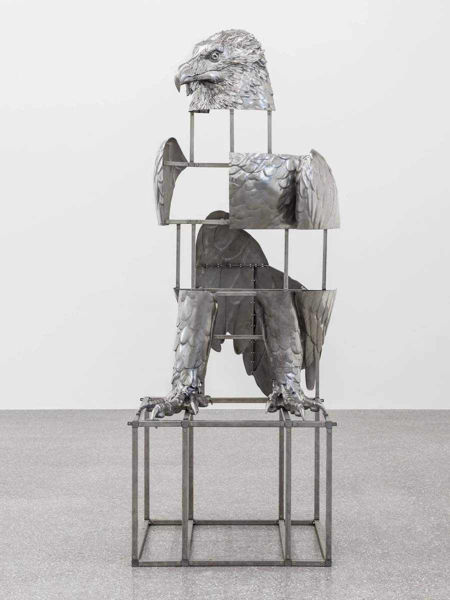 Oliver Laric at Galerie Brugger by Oliver Laric — A cast aluminum eagle taken apart into head, wing shells and talons, the gaps bridged by a bolted steel armature.