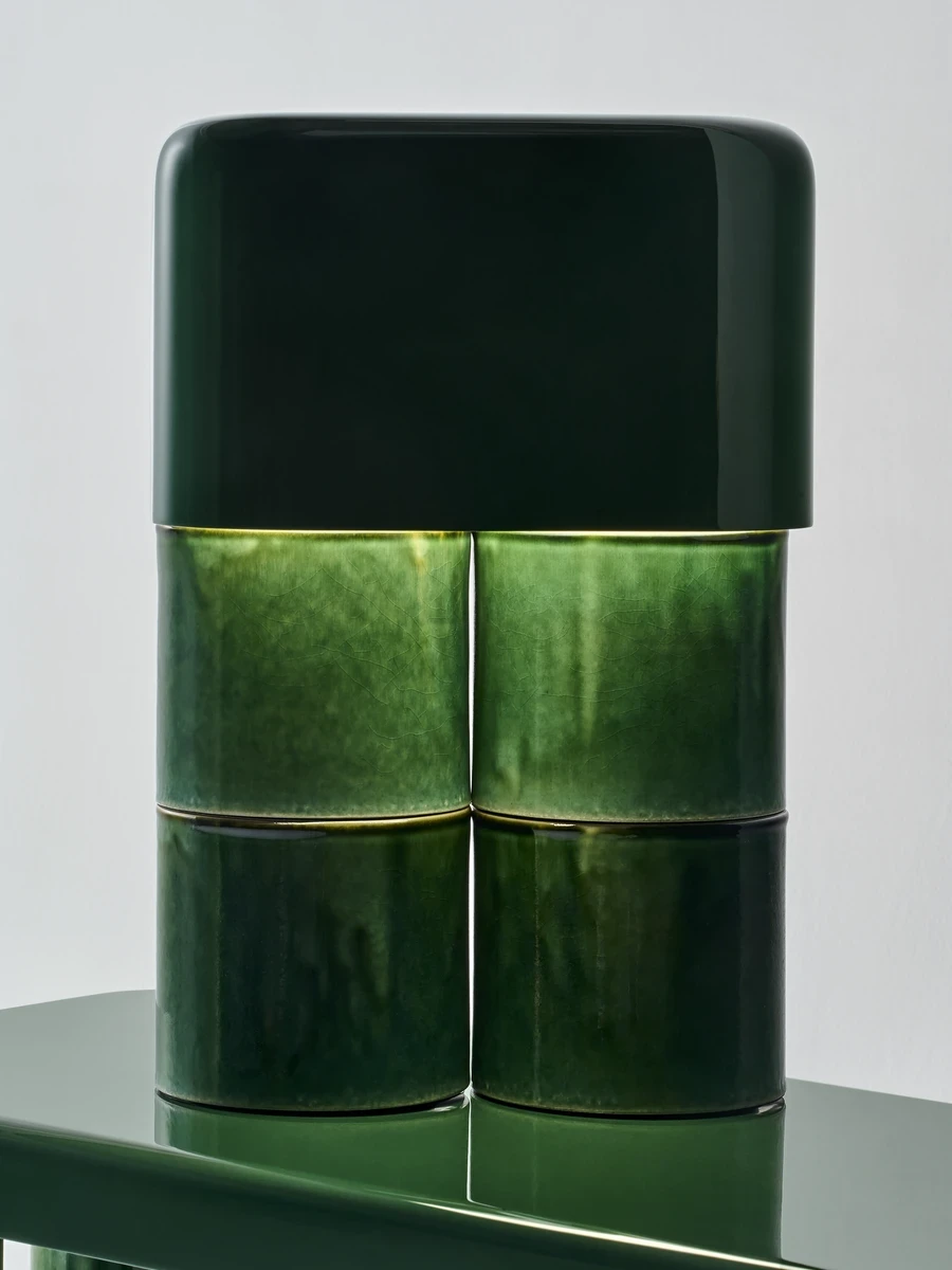 FUSHI by David Caon, photographed by Masayuki Hayashi — Close framing of the lamp on the console top, a three-module ceramic stack capped by a glossy darker hood, the segmented joints catching the light