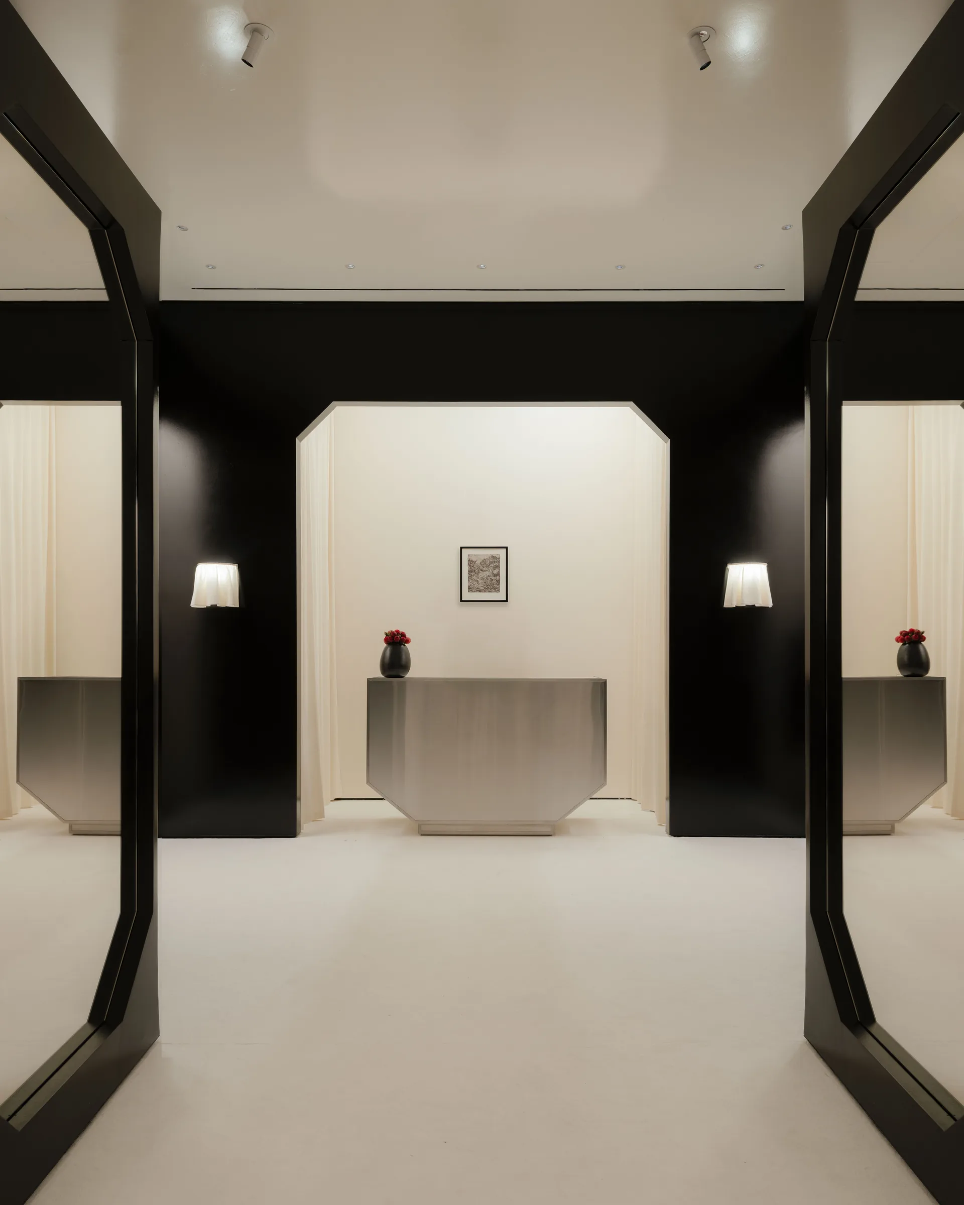 Roses Lace by EDXXKAT: deep glossy black walls cut by white lightboxes that turn each dress into an exhibit.