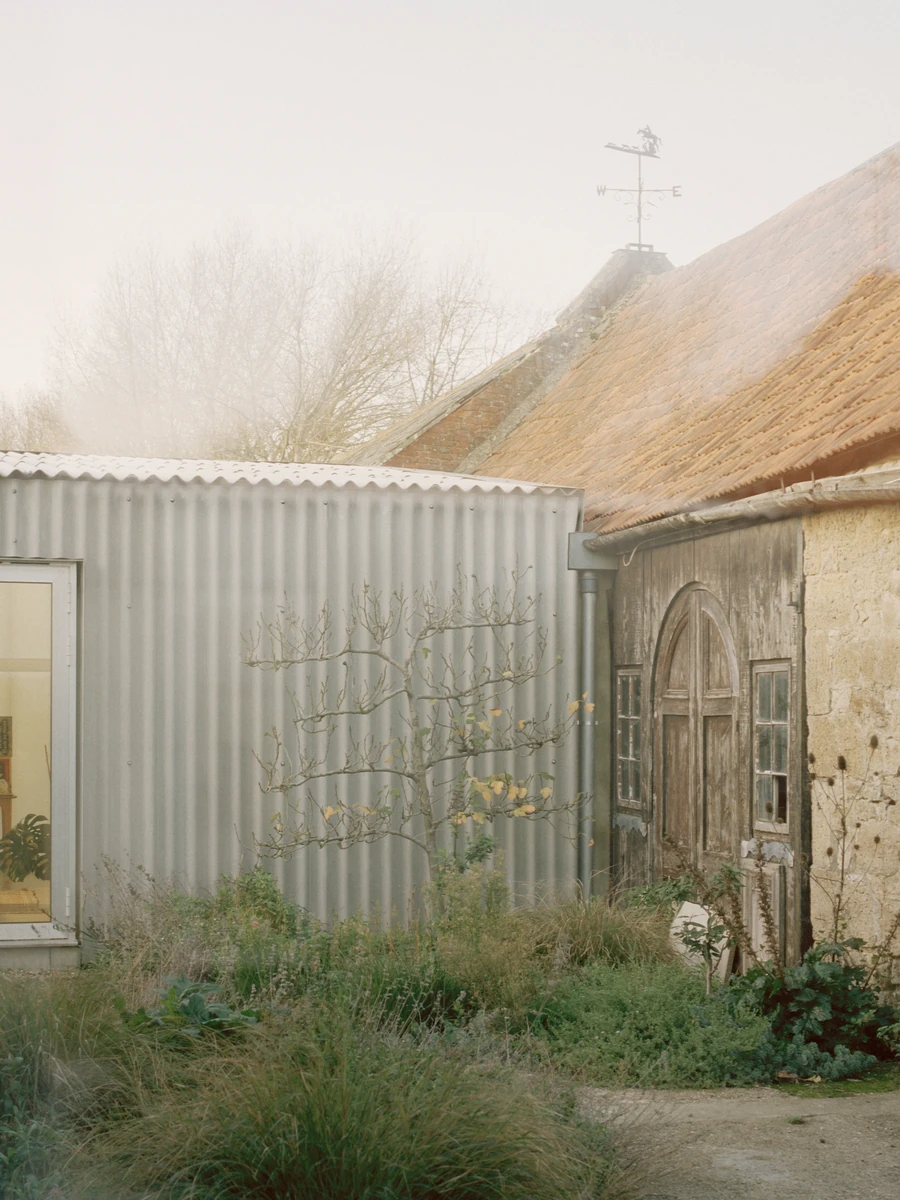 The Old Byre by Gianni Botsford Architects, photographed by Willem Pab — conversion of two farm buildings into a home and artist residency on the Isle of Wight, United Kingdom