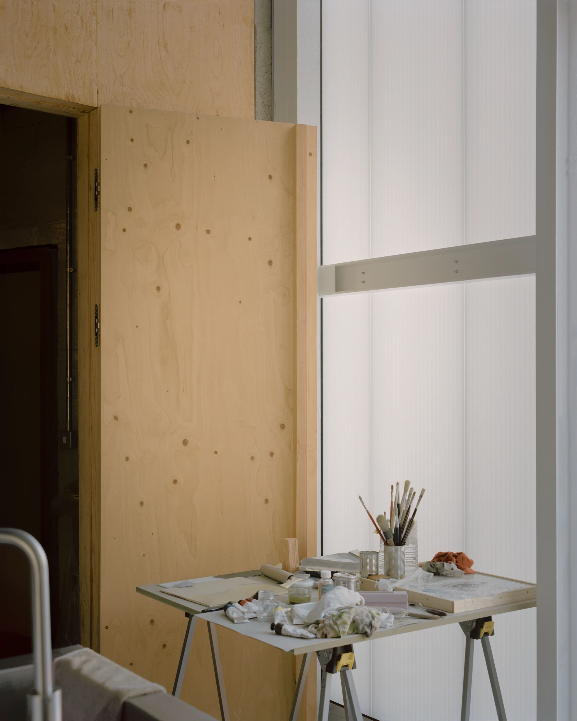 The Old Byre by Gianni Botsford Architects, photographed by Willem Pab — conversion of two farm buildings into a home and artist residency on the Isle of Wight, United Kingdom