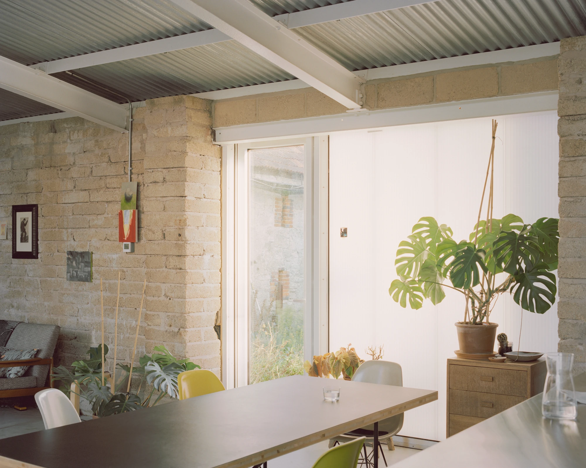 The Old Byre by Gianni Botsford Architects, photographed by Willem Pab — conversion of two farm buildings into a home and artist residency on the Isle of Wight, United Kingdom