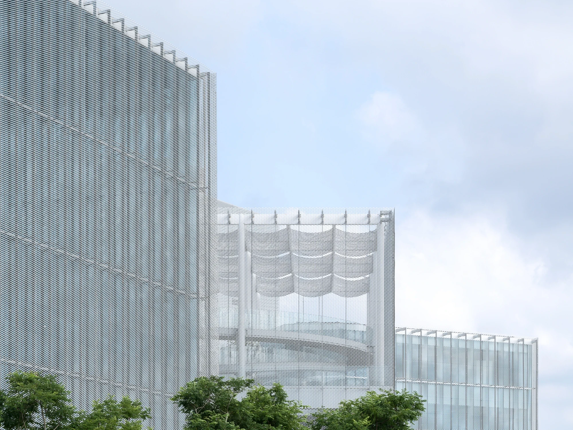Taichung Art Museum by SANAA, photographed by Yi-Hsien Lee (YHLAA) — A scalloped mesh canopy drapes over a rooftop terrace where a curved ramp shows through the vertical glass-fin facade.