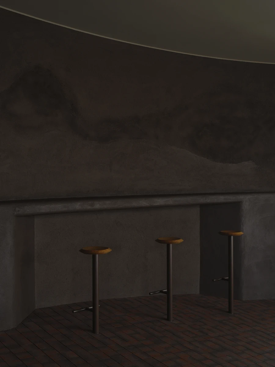 NIWA FUKUOKA by ANONIMAL design community — Fukuoka, Japan: The counter sits at the highest point of NIWA FUKUOKA, a café by ANONIMAL design community lifted onto a rooftop in Fukuoka, where a curved earthen wall traces the ridgeline of the mountains hidd