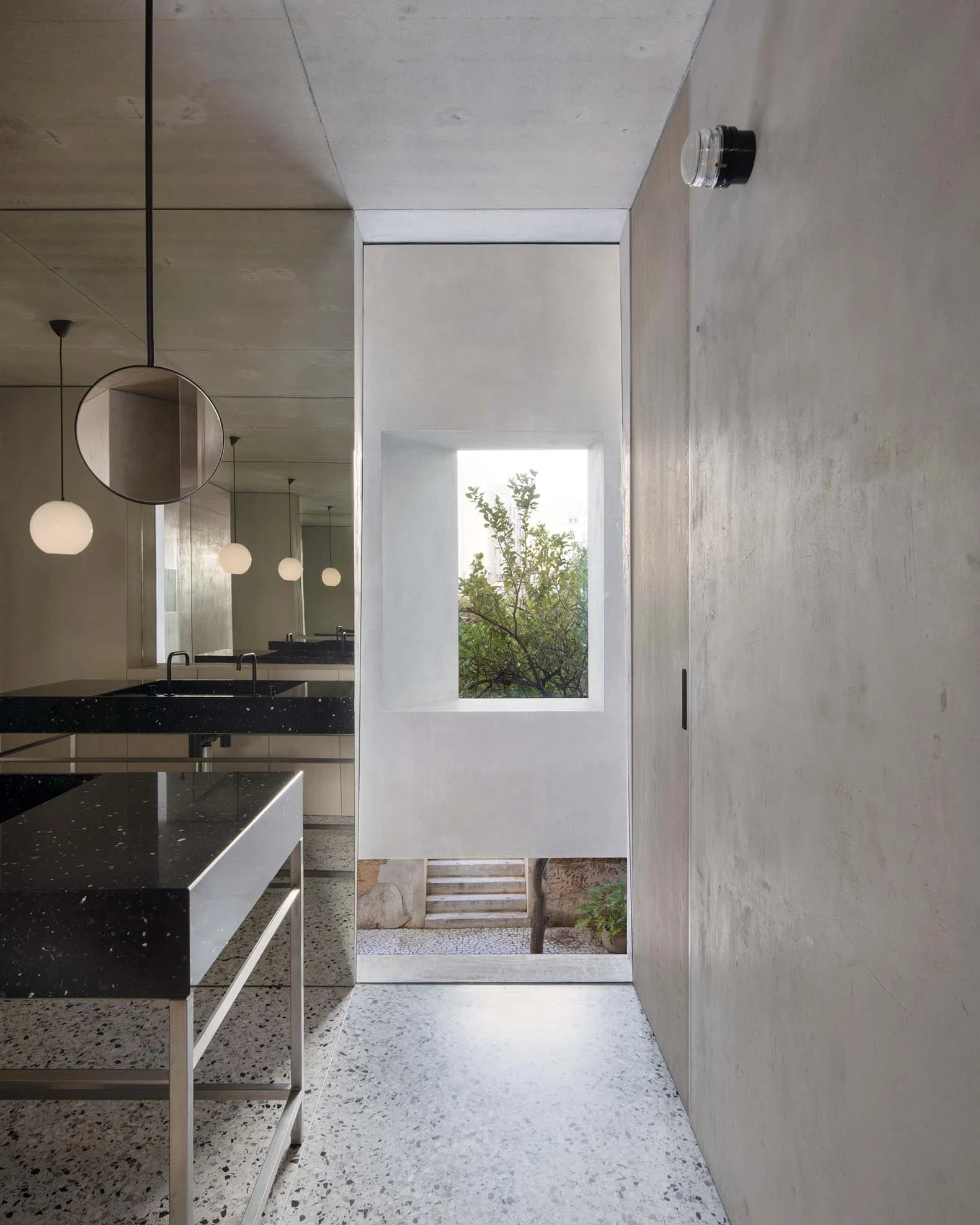 Casa Azul by extrastudio, photographed by Mikael Olsson — the hand-brushed blue lime wall beside a glazed slot, jasmine climbing over the paved courtyard.
