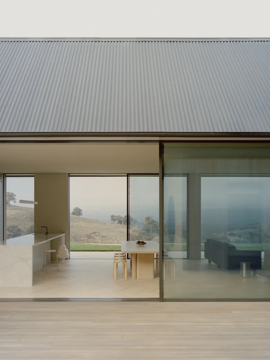Cathedral House by JAK Architecture, photographed by Tasha Tylee — the board-formed concrete and timber retreat set against the rural ranges.