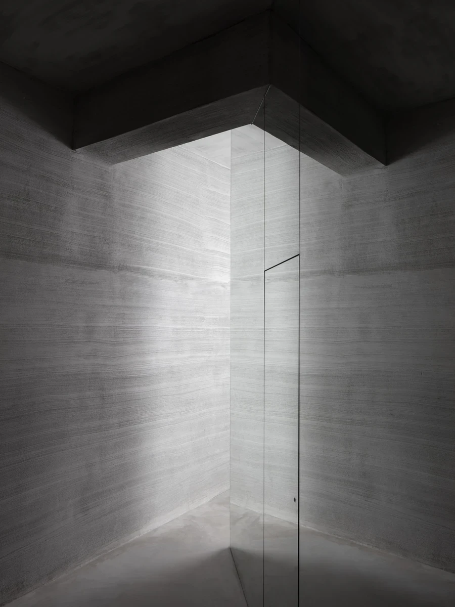 Ximen Apartment by unprofessional.studio, Taipei, Taiwan: concrete interior reflected in mirror walls.
