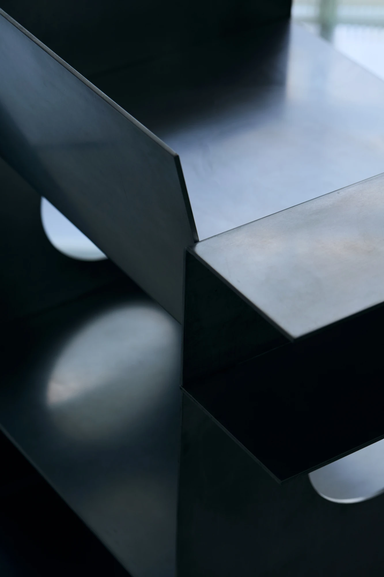 010 Aluminium Lounge Chair by OFAA, photographed by @spaceblank, @aura.photography — Backrest and armrest folds read from above, the 5 mm aluminium held at right angles.