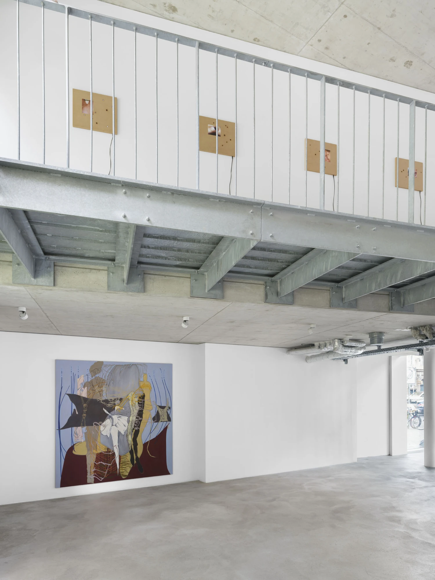 Apophenia by Galerie Molitor, photographed by Marjorie Brunet-Plaza — A vertical view: MDF screen panels along the mezzanine above, the powder-blue painting on the white wall below.