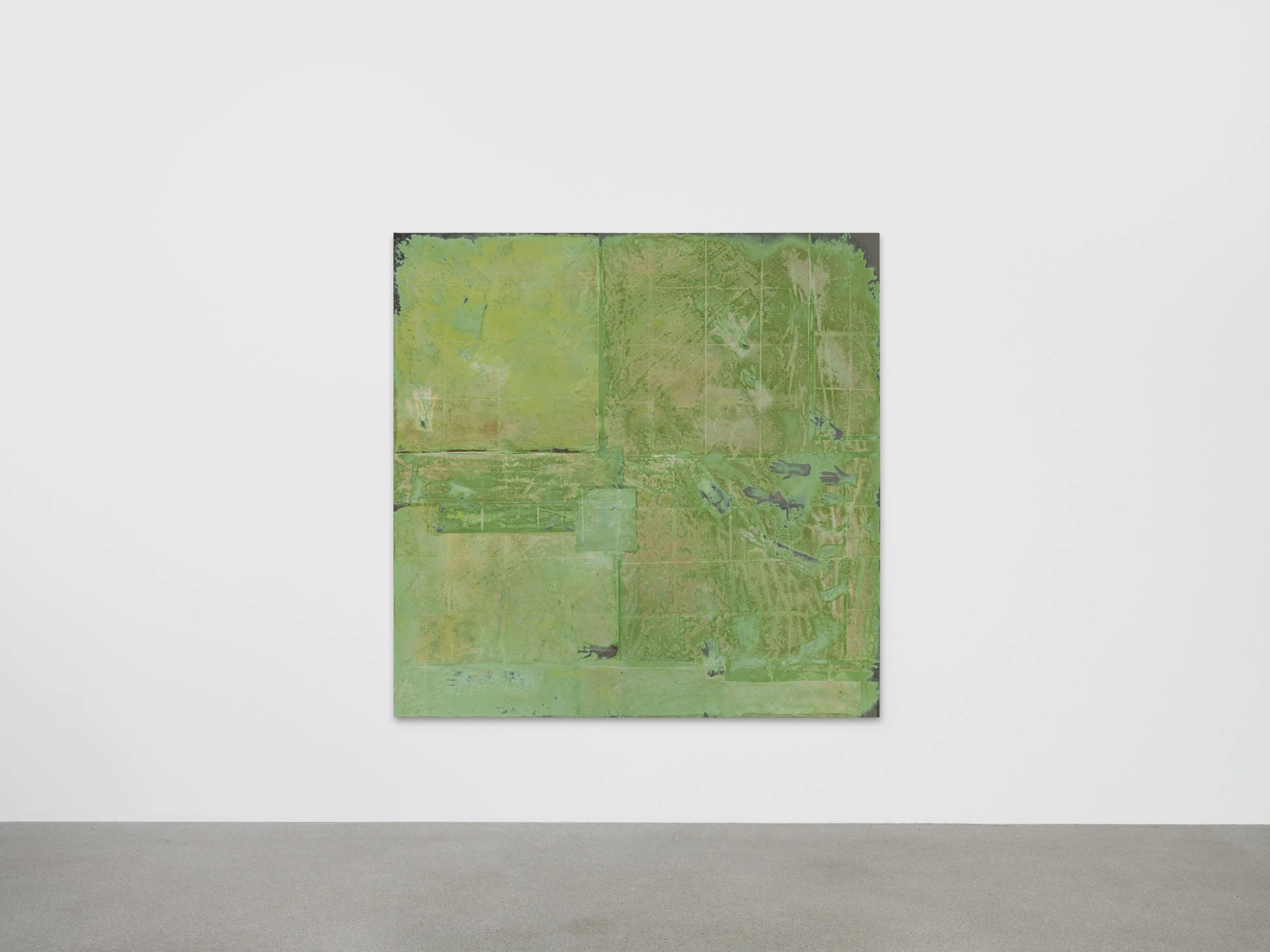 Dolls' Theater by Mimosa Echard, photographed by Julien Gremaud, Annik Wetter — A large green tableau gridded by fabric seams, pale handprints surfacing across the lower right quarter.