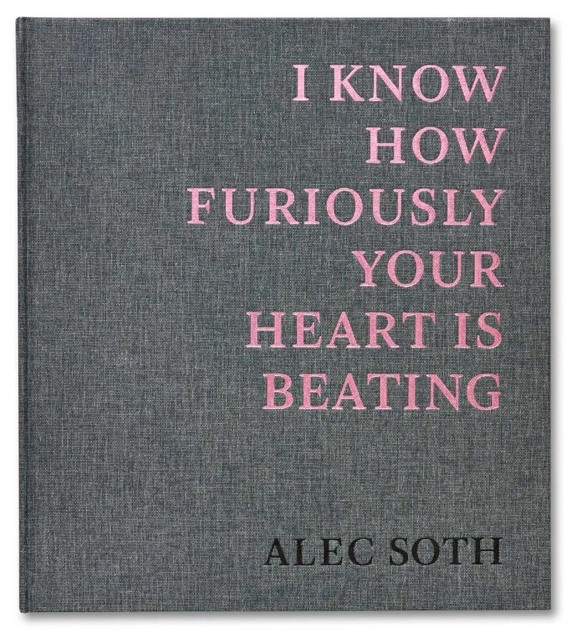 The book I Know How Furiously Your Heart Is Beating, bound in grey linen with the title set in pink capitals above the author's name in black.