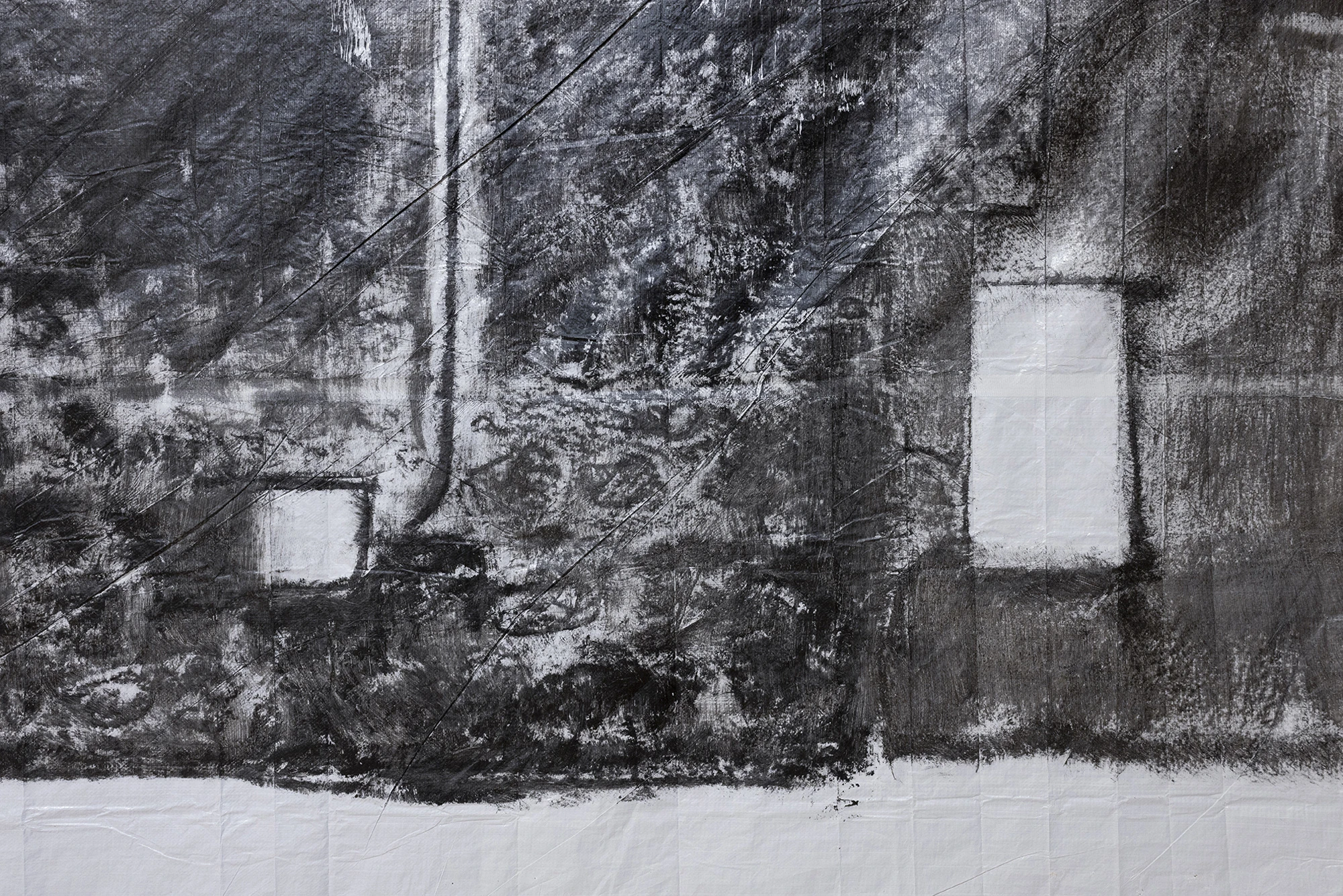 KIN TOO by Spiritvessel, photographed by Roberto Ruiz — Detail of Andrew Birk's Floating House, the dense black impression of a stone facade and its windows transferred onto creased canvas.