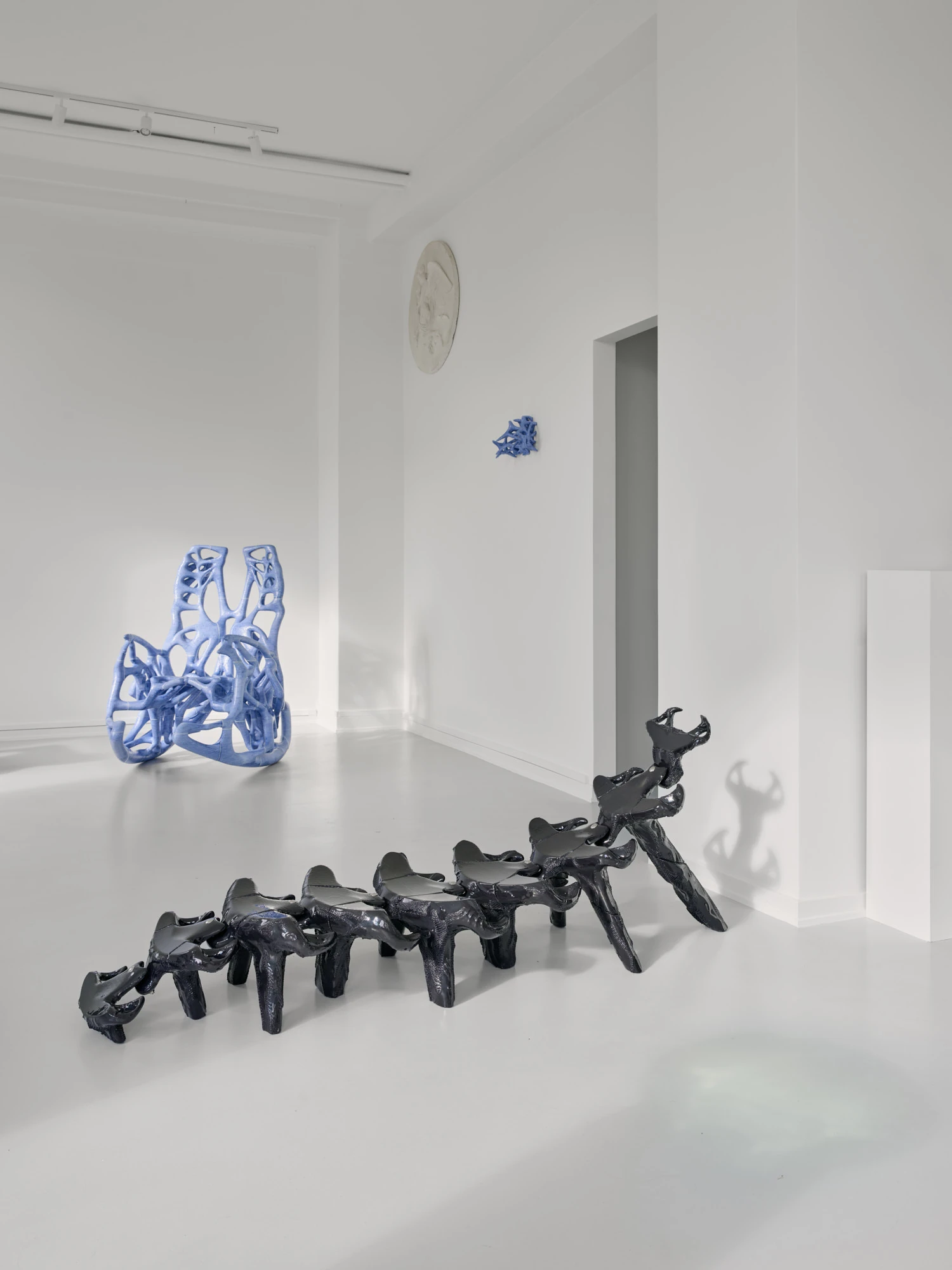Extrude, Bridge, Fill by Lasse Sylvest Lilleør, photographed by Robert Damisch — Front view of the Rocking Chair, its symmetrical ribcage of bone-blue ligaments rising from curved rockers.