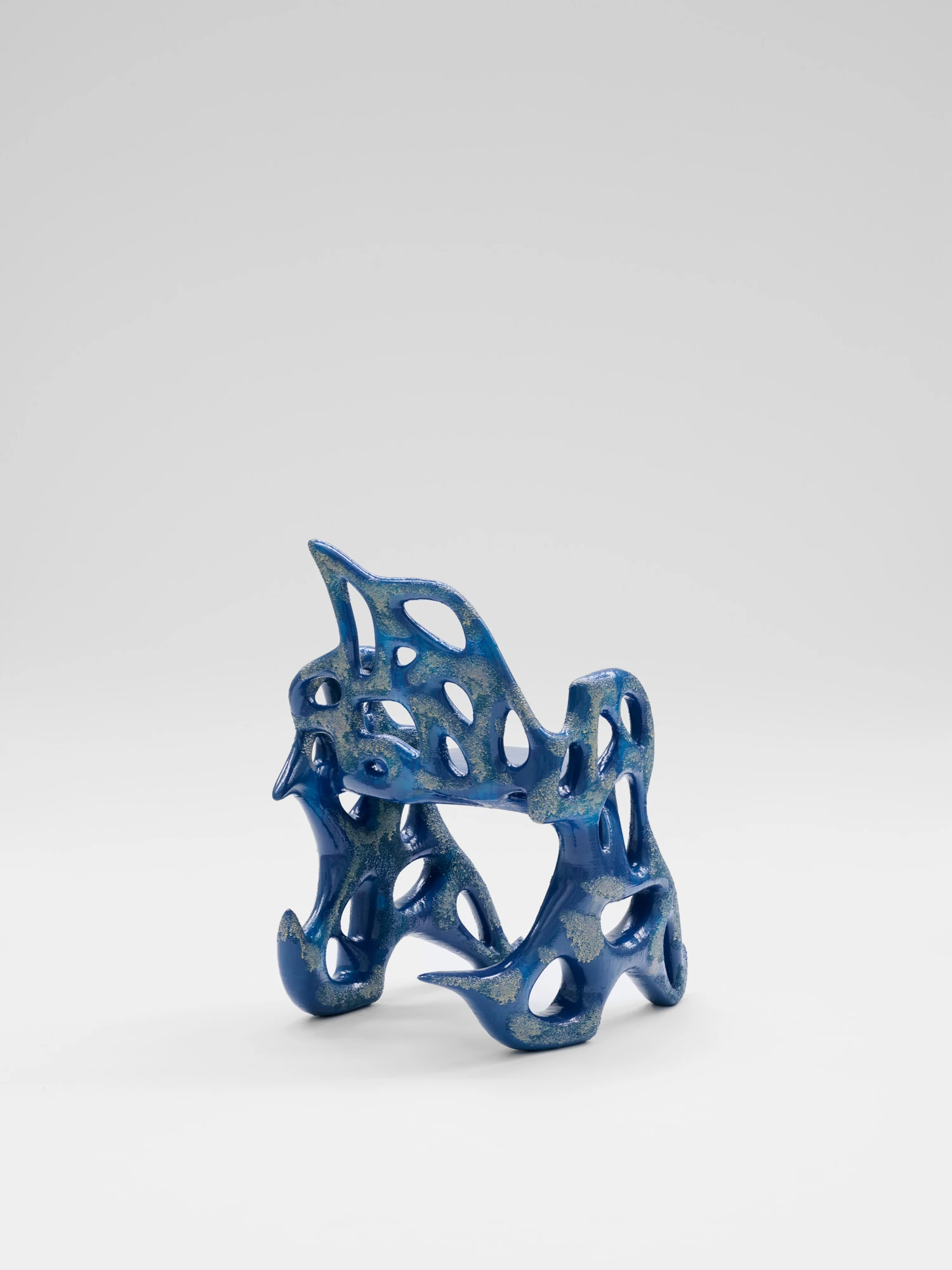 Extrude, Bridge, Fill by Lasse Sylvest Lilleør, photographed by Robert Damisch — The Sleigh Chair at an angle, its fin-like back and open flanks.