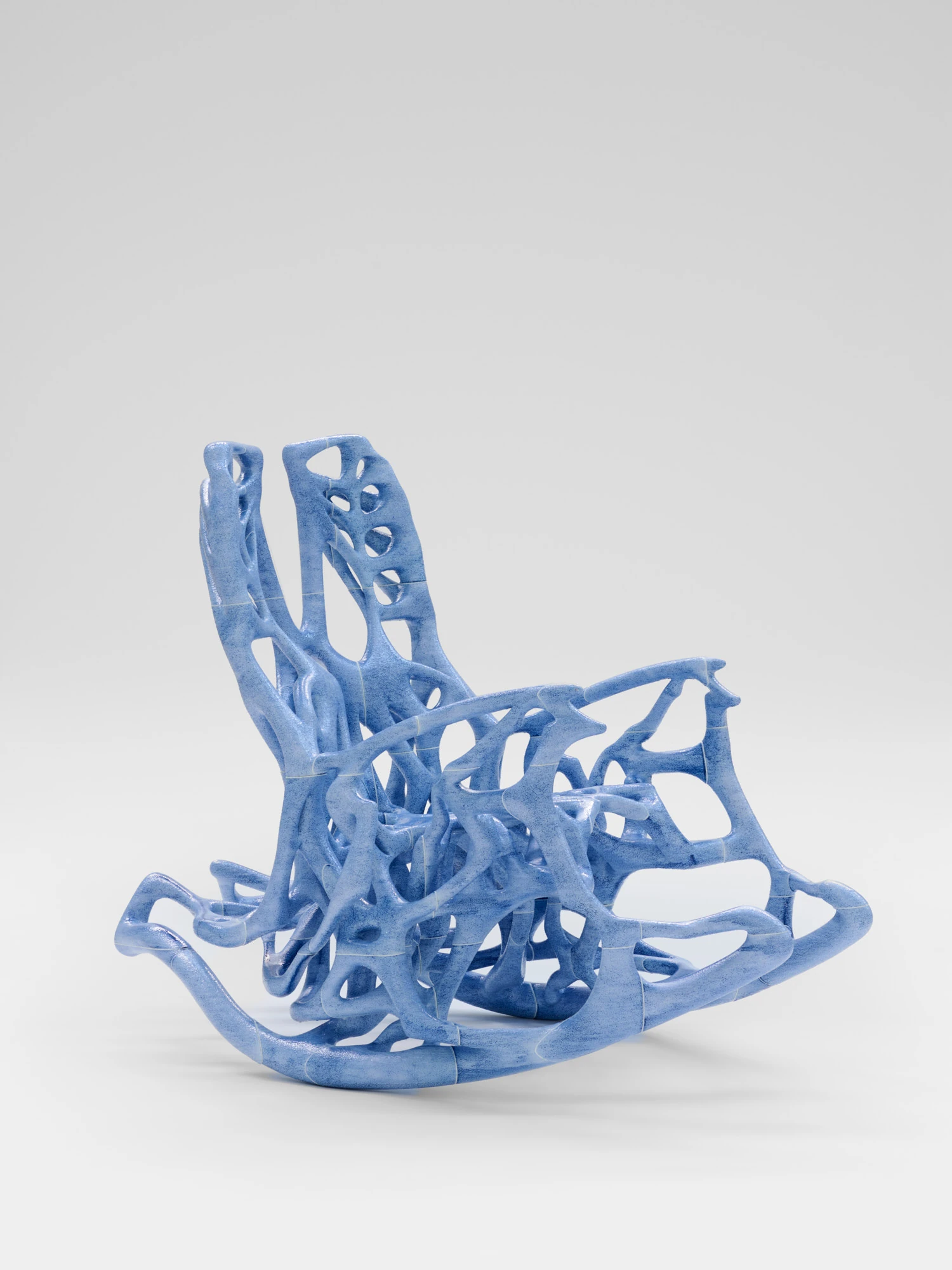 Extrude, Bridge, Fill by Lasse Sylvest Lilleør, photographed by Robert Damisch — The Rocking Chair from the side, its rockers and open lattice carrying the seat.